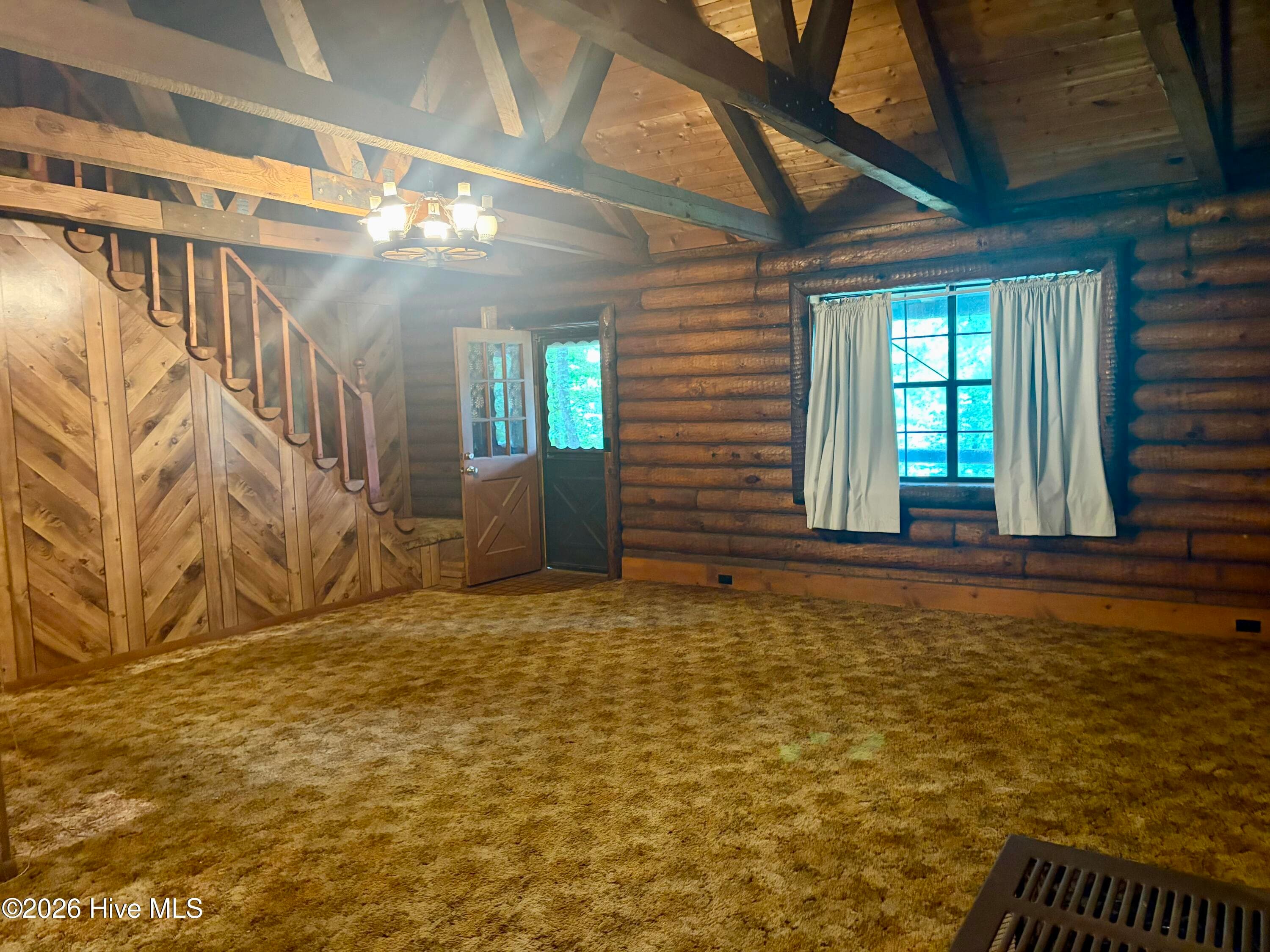 Living room - staircase and exposed rafters - 913 Franks Creek Road, Robbinsville, NC 28771