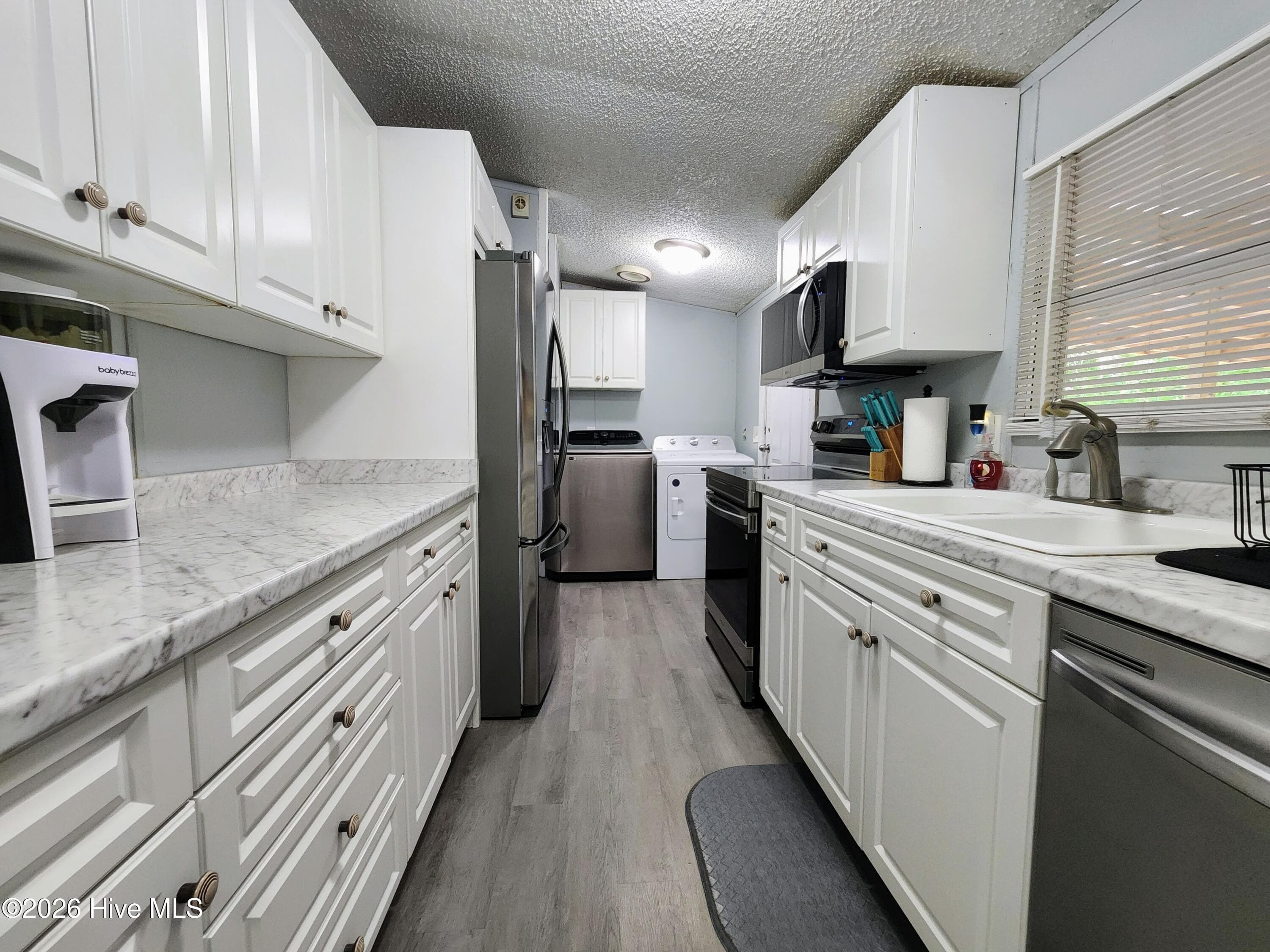 Manufactured Home at 623 Sandy Bluff Drive SW, Supply, NC 28462, photo 6 of 26