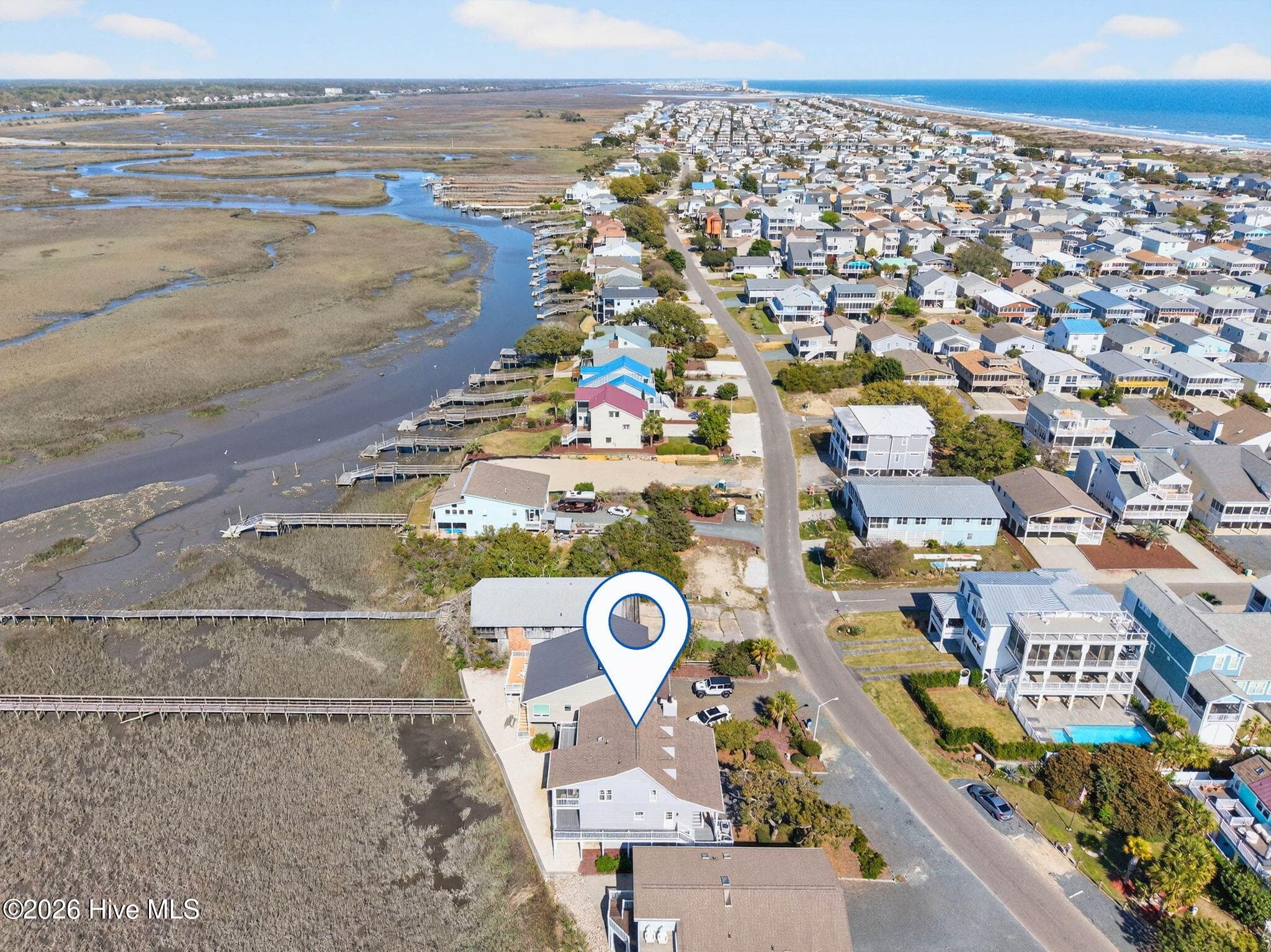 Aerial view of Sunset Beach neighborhood with proximity to water and coastal surroundings. - 1206 N Shore Drive W, Sunset Beach, NC 28468