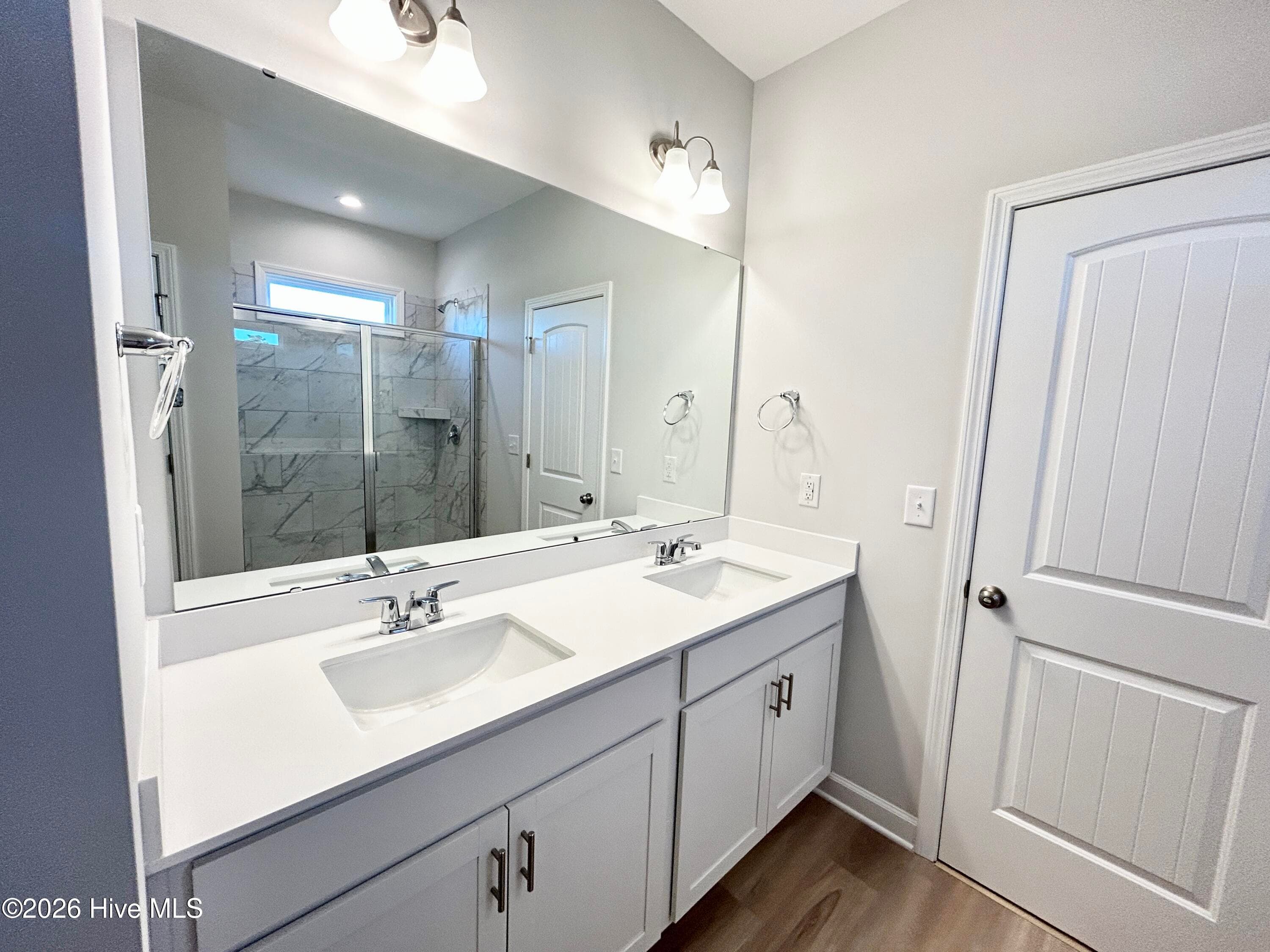 Primary Suite features a Private Bathroom with Tile Shower and Large Walk-in Closet - 4153 Workman Loop 68, Leland, NC 28451