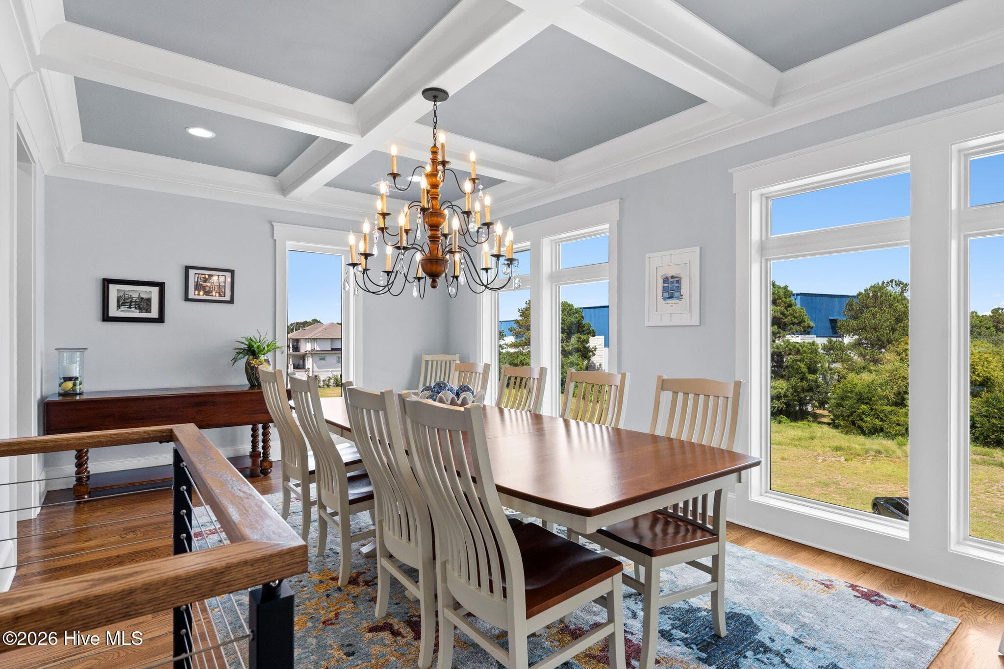 Coffered ceiling and a Lt Willard Moses chandelier provide a comfortable room for entertaining - 2775 Long Bay Drive SE, Southport, NC 28461