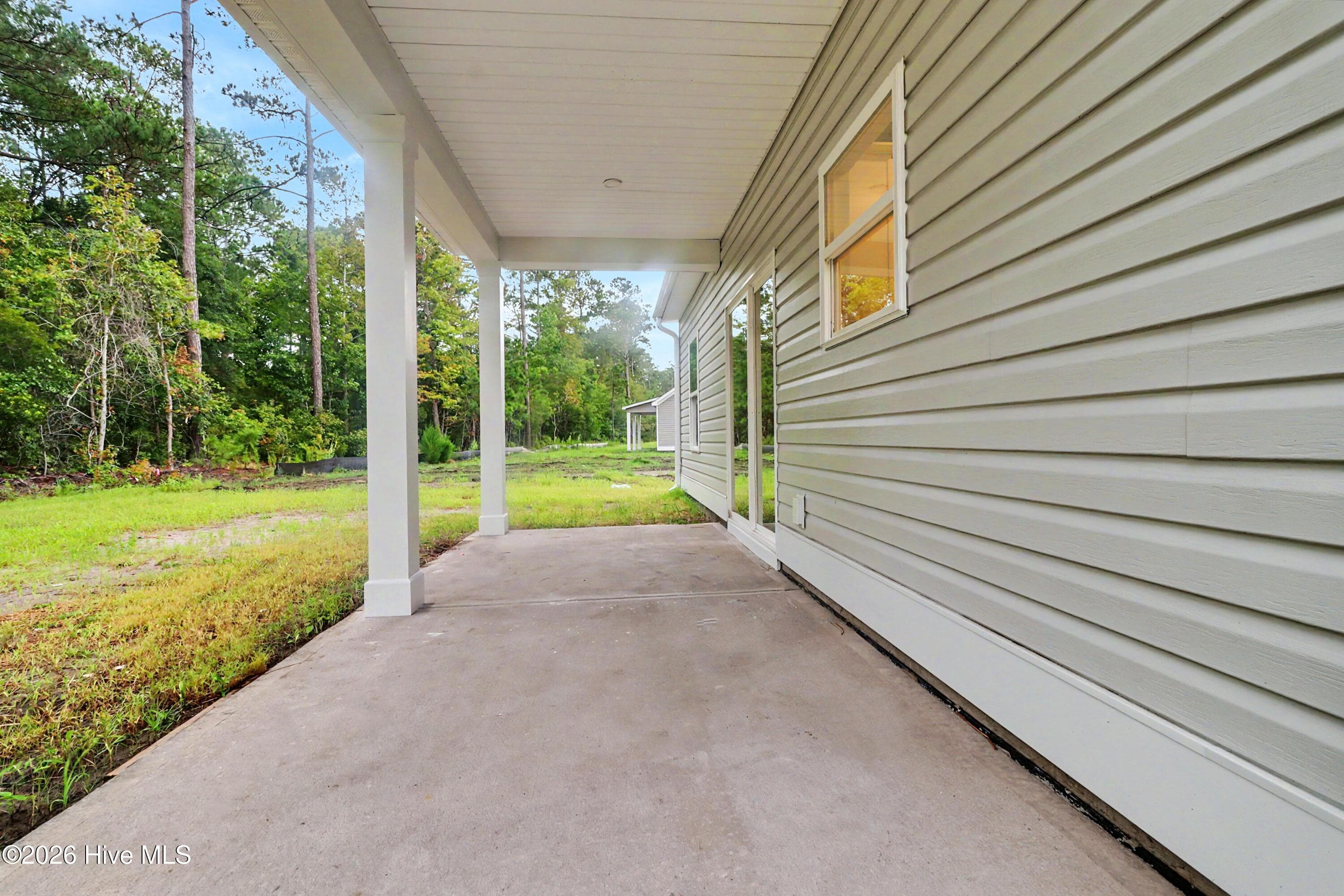 Covered patio along rear of home. - 2111 Cregan Cove SW (Lot 19), Ocean Isle Beach, NC 28469