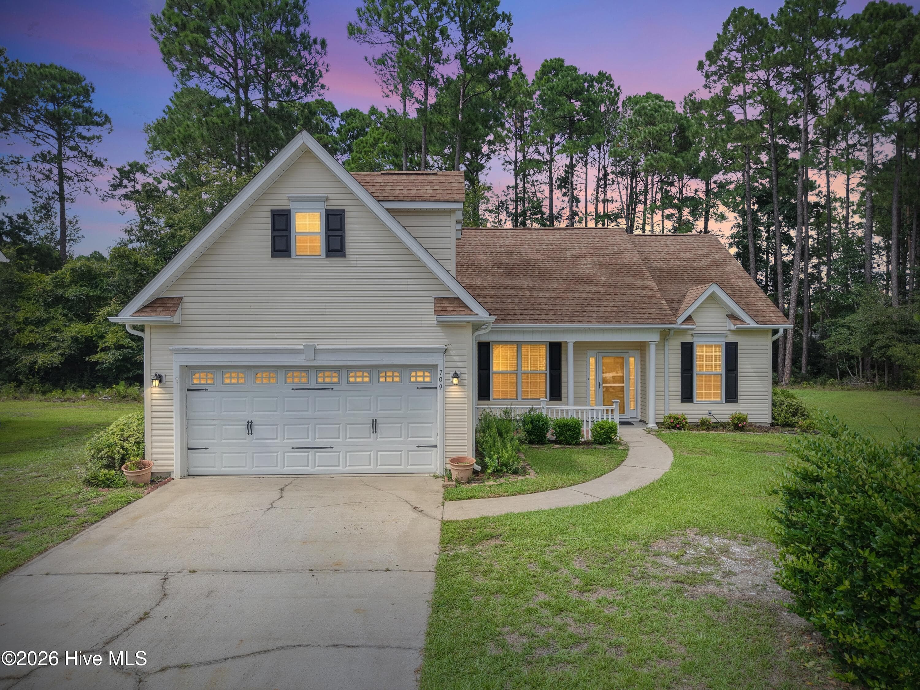 This 3 bed, 2 bath home is located in a cul-de-sac. - 709 E Pipers Glen, Shallotte, NC 28470