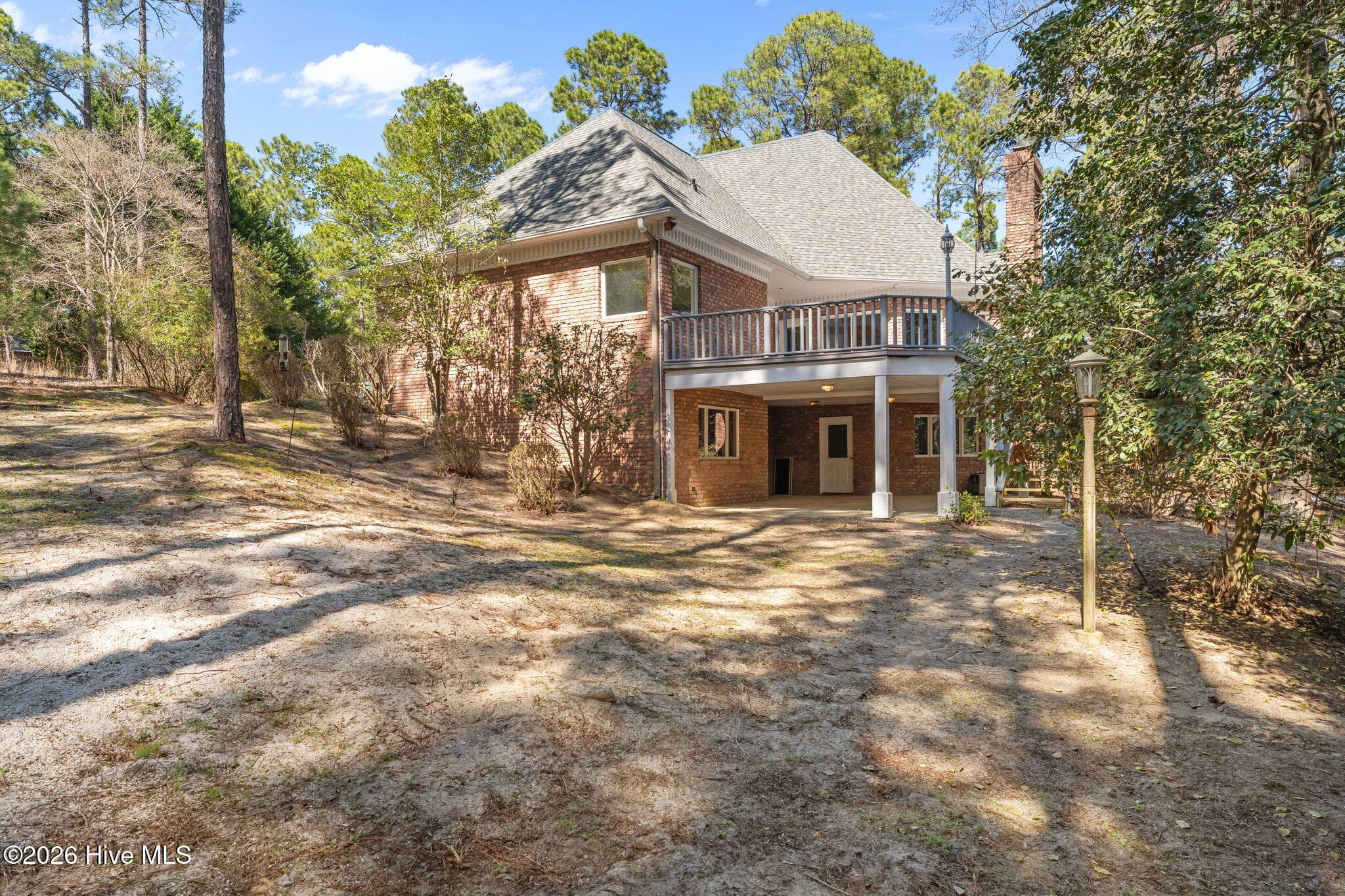 Left side of the backyard. - 22 Lochmere Drive, Pinehurst, NC 28374