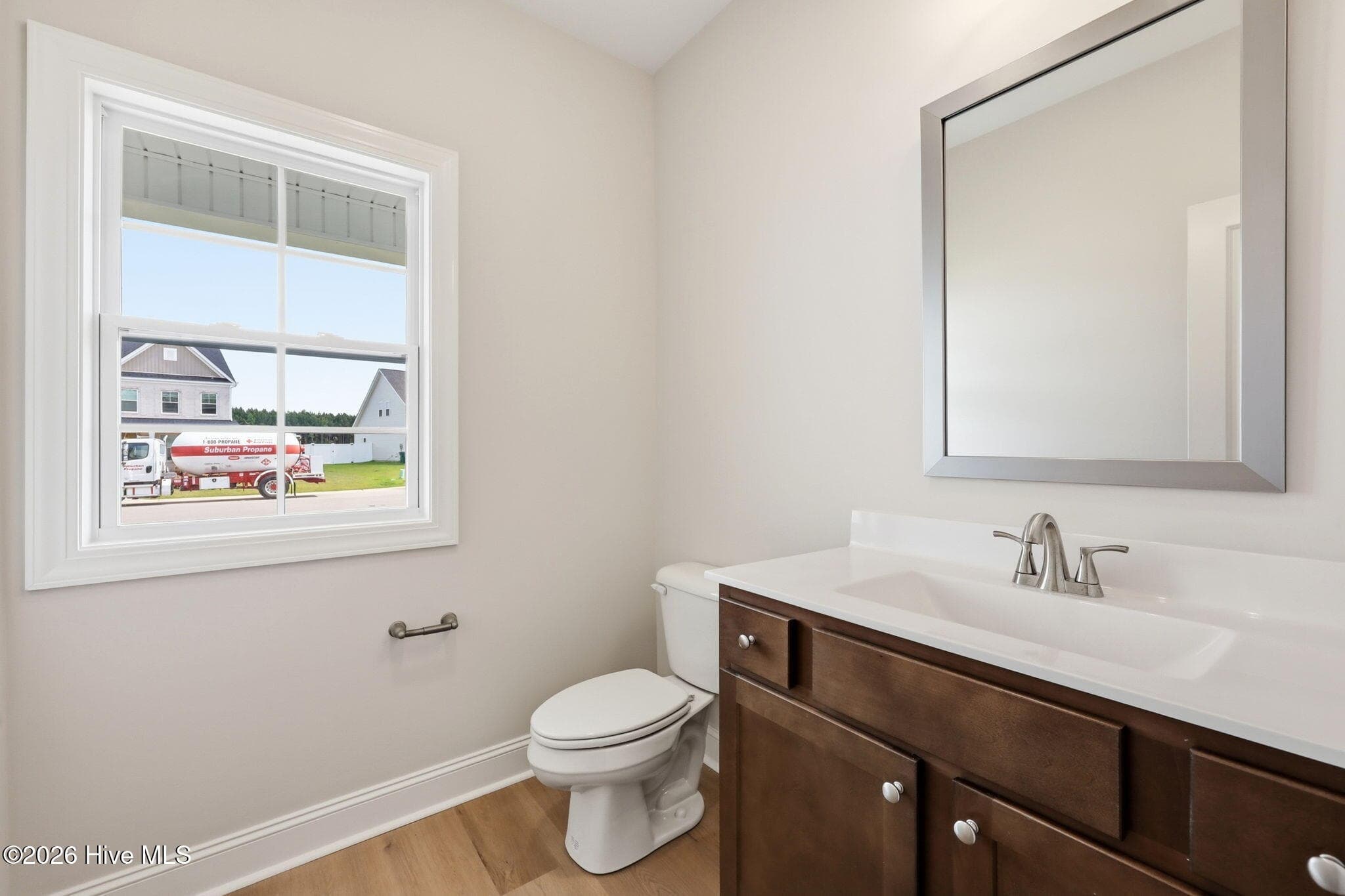 downstairs half bath for guests - 1005 Finn Court, Greenville, NC 27834