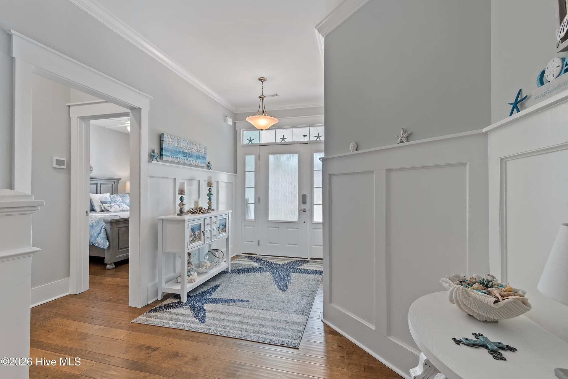 Foyer of home. Notice the wainscoting. - 6358 Bryson Drive SW, Ocean Isle Beach, NC 28469