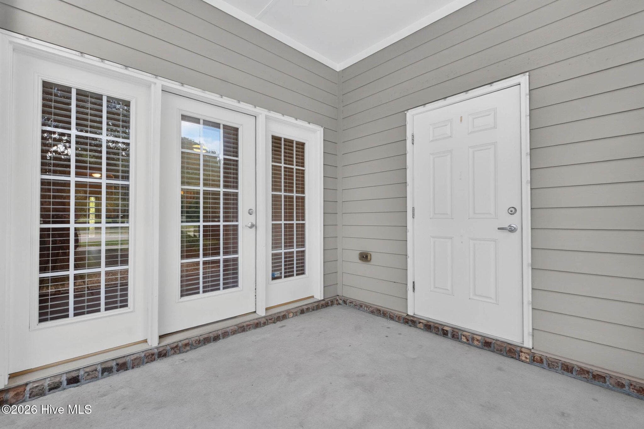 Storage on the screened-in porch - 7825 High Market Street #303, Sunset Beach, NC 28468