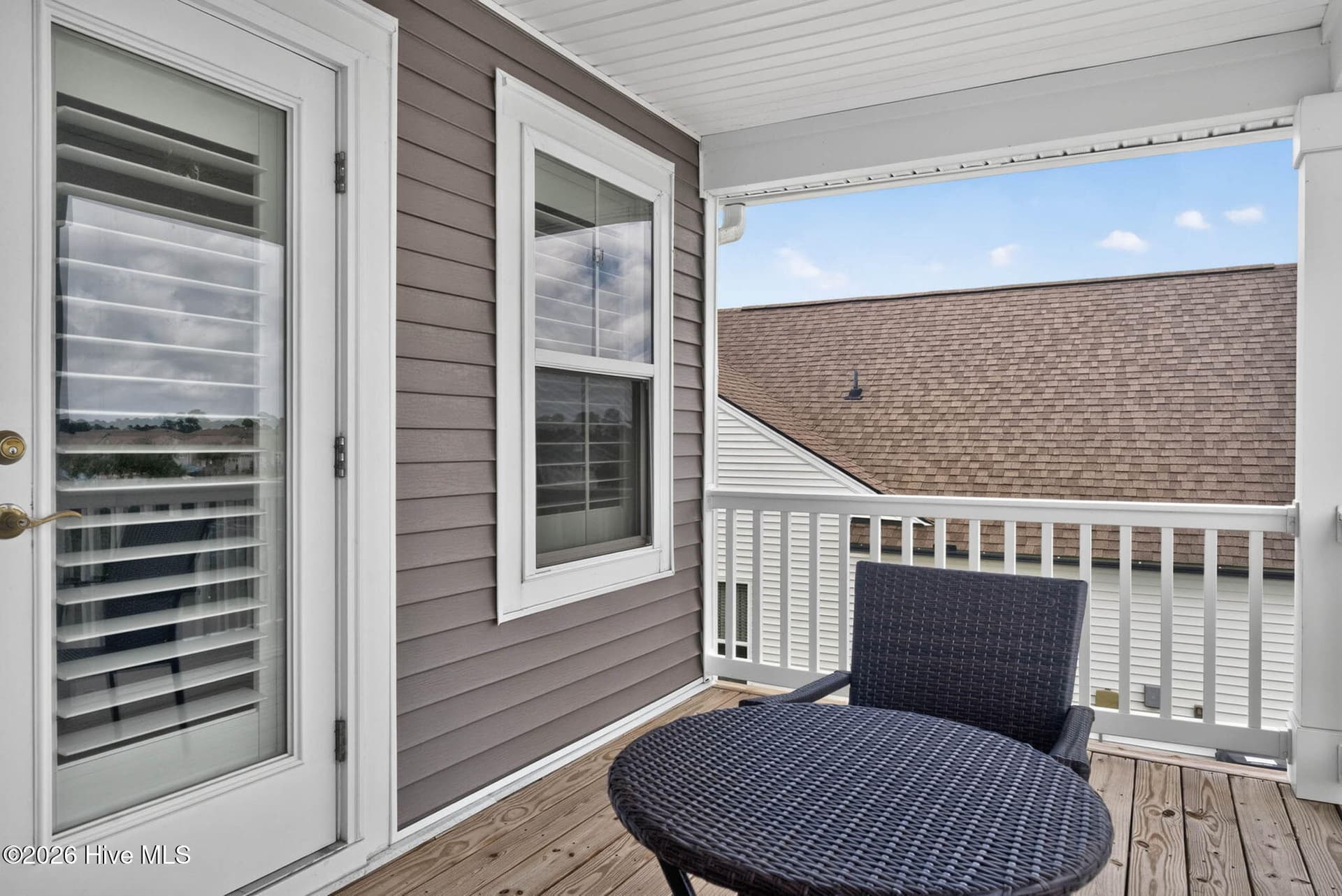 Another view of the private balcony highlights the comfortable outdoor space available to upstairs guests. - 139 Eagle Claw Drive, Calabash, NC 28467