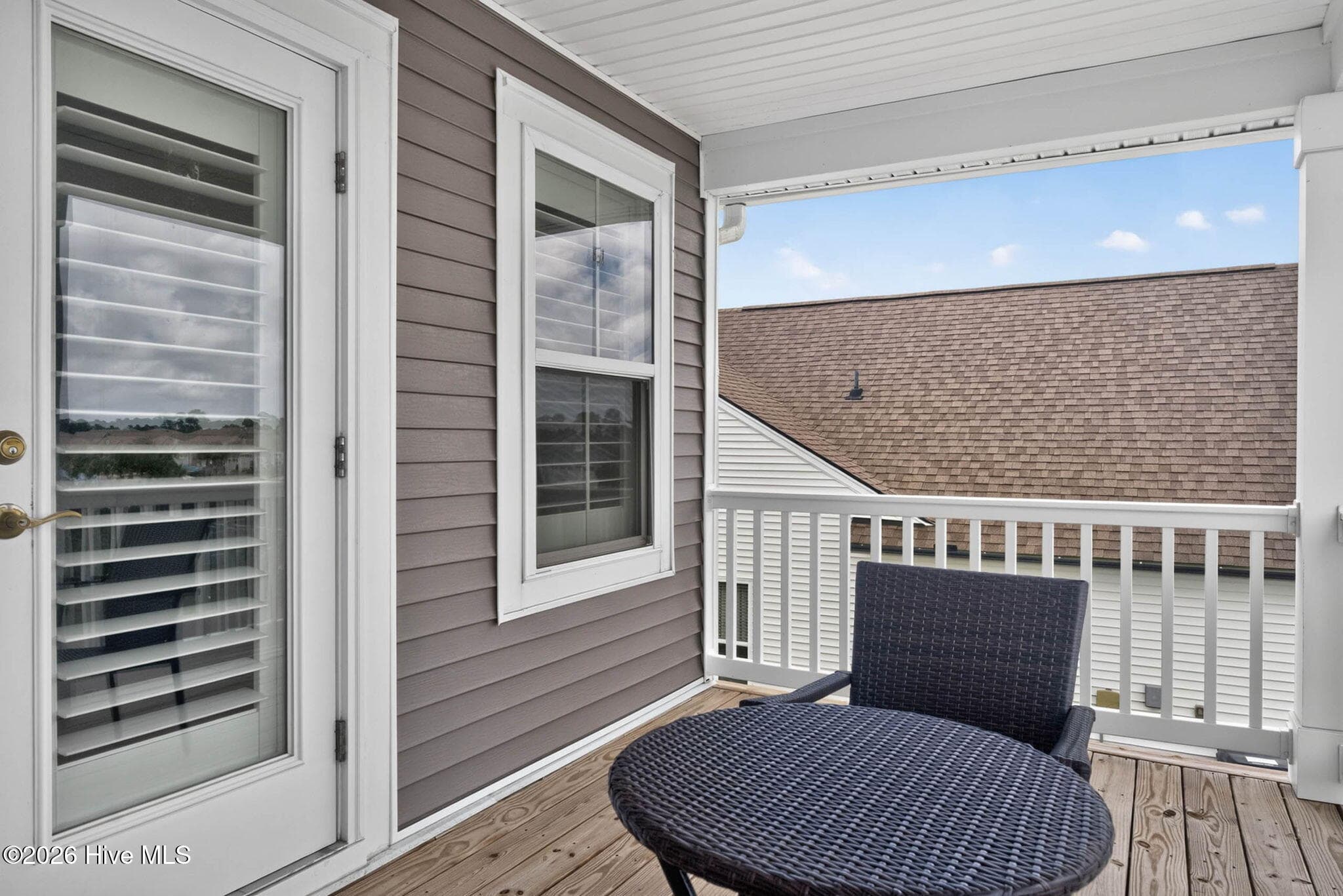 Another view of the private balcony highlights the comfortable outdoor space available to upstairs guests. - 139 Eagle Claw Drive, Calabash, NC 28467