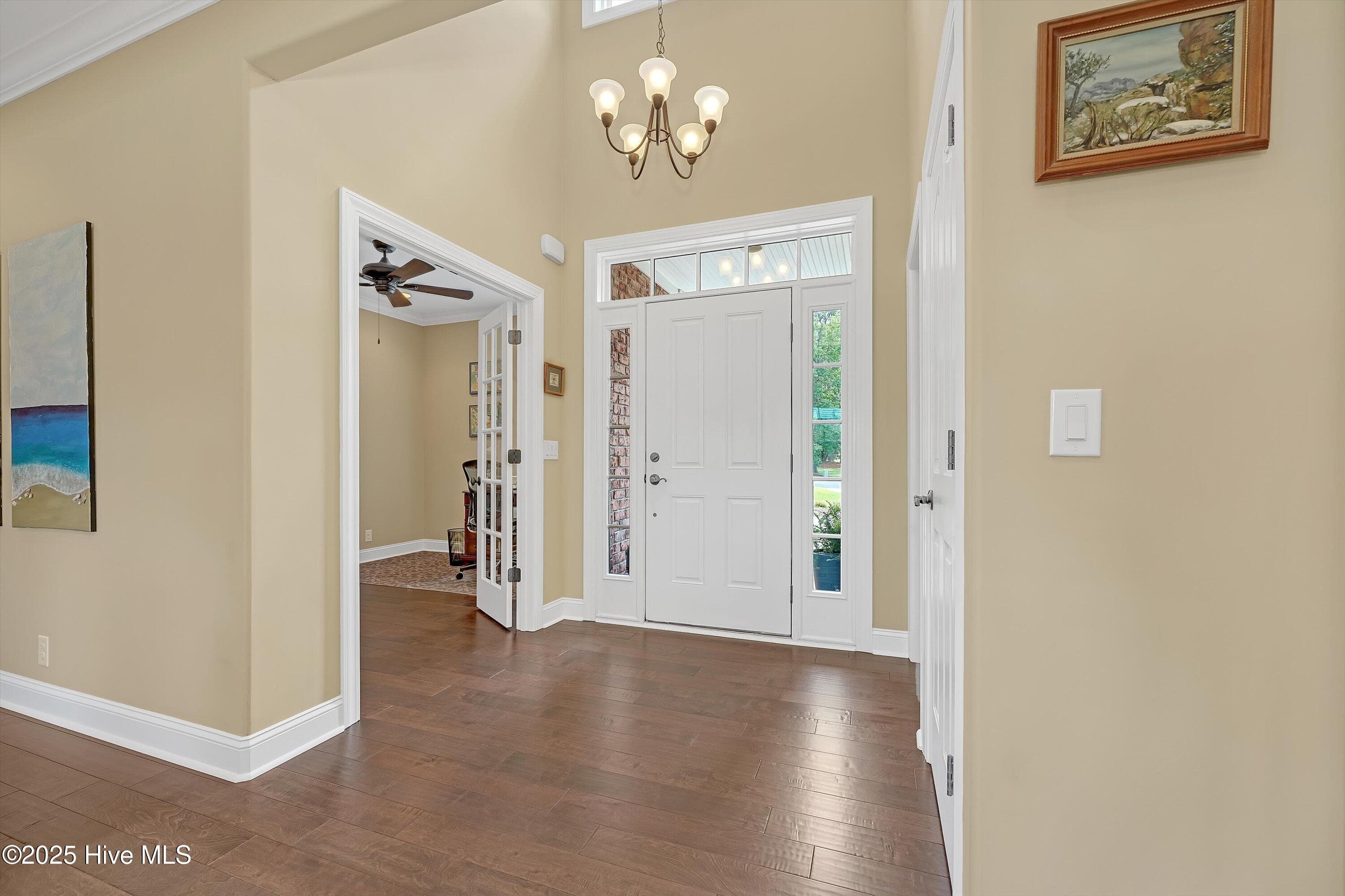 Foyer with Office on left and Half Bath on right - 102 Reflection Court SW, Ocean Isle Beach, NC 28469