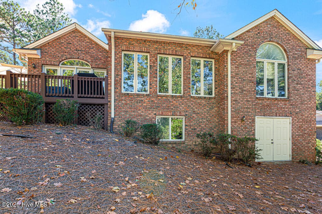 25 Ivy Way Pinehurst NC back of house with golf cart garage/storage - 25 Ivy Way, Pinehurst, NC 28374