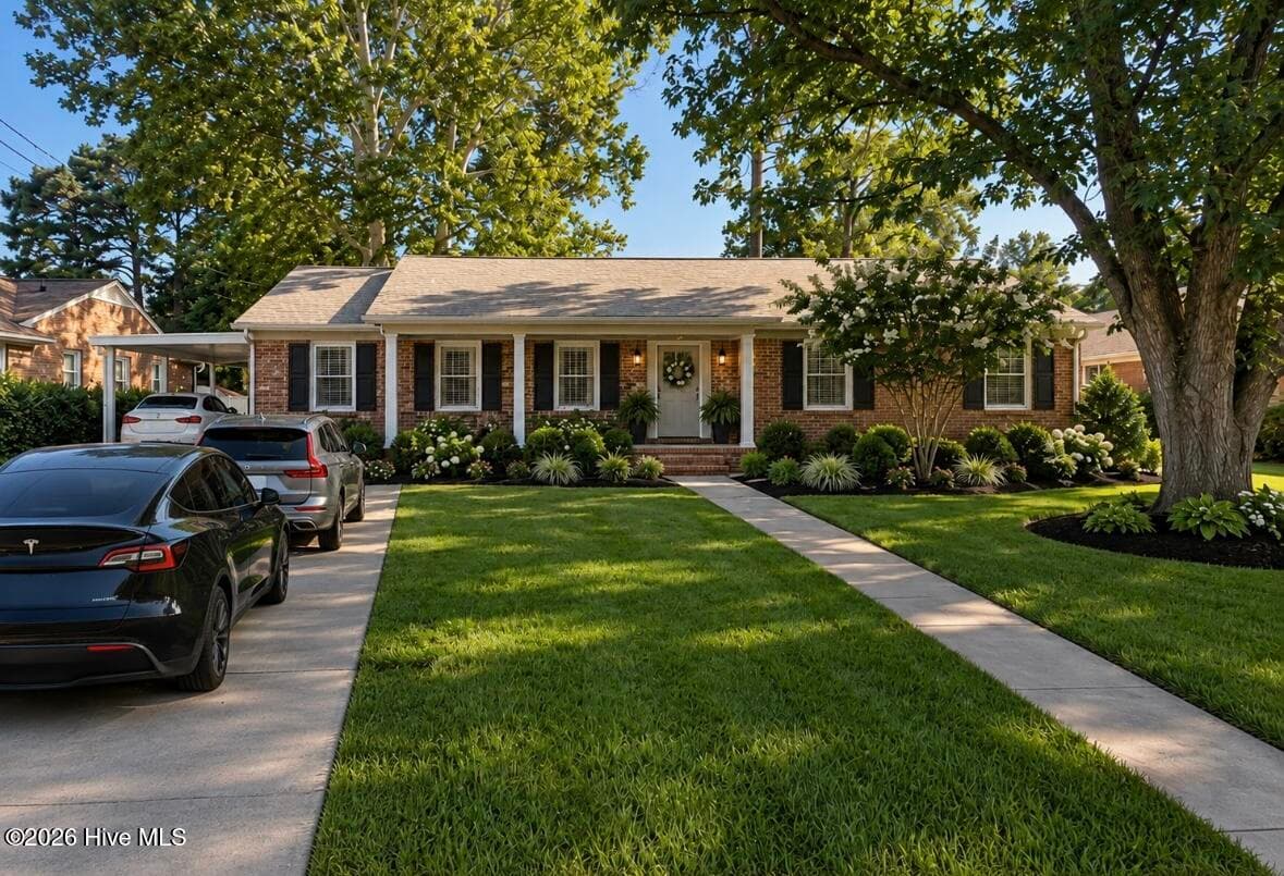 This photo has been AI generated to show 3 cars in the driveway. - 2104 Charles Boulevard, Greenville, NC 27858