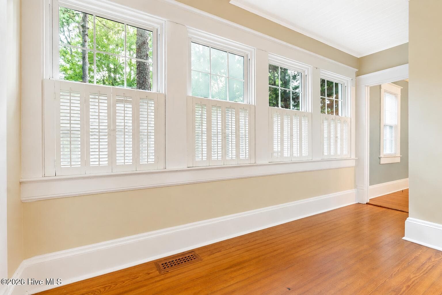 Sun Porch (heated and cooled) connected to living room and dining room. Can be used as office, play room, or flex space - 160 N Ridge Street, Southern Pines, NC 28387