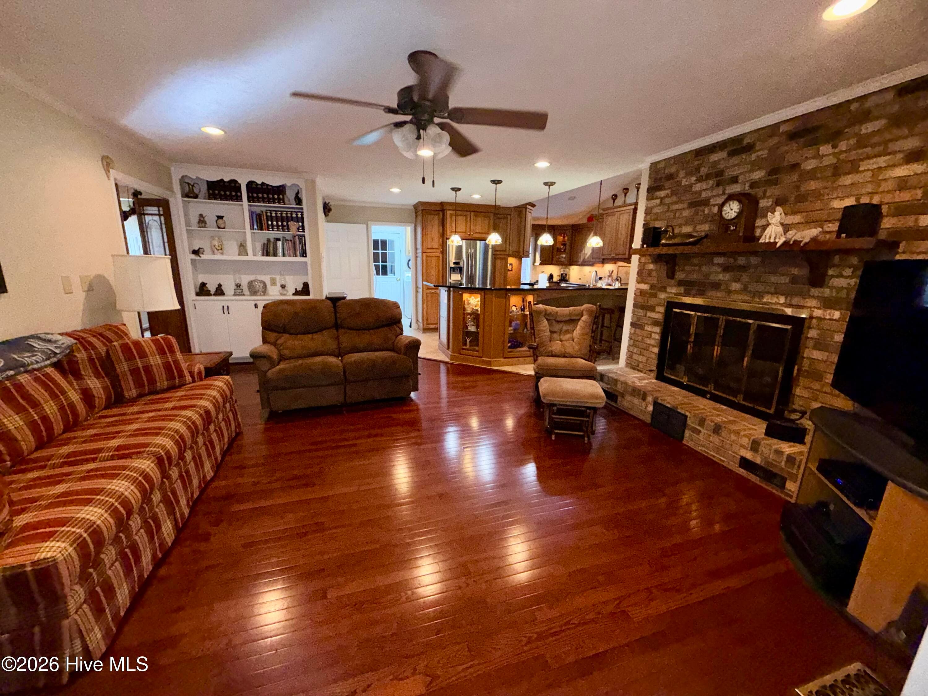 family room with gas logs - 12681 Blues Farm Road, Laurinburg, NC 28352