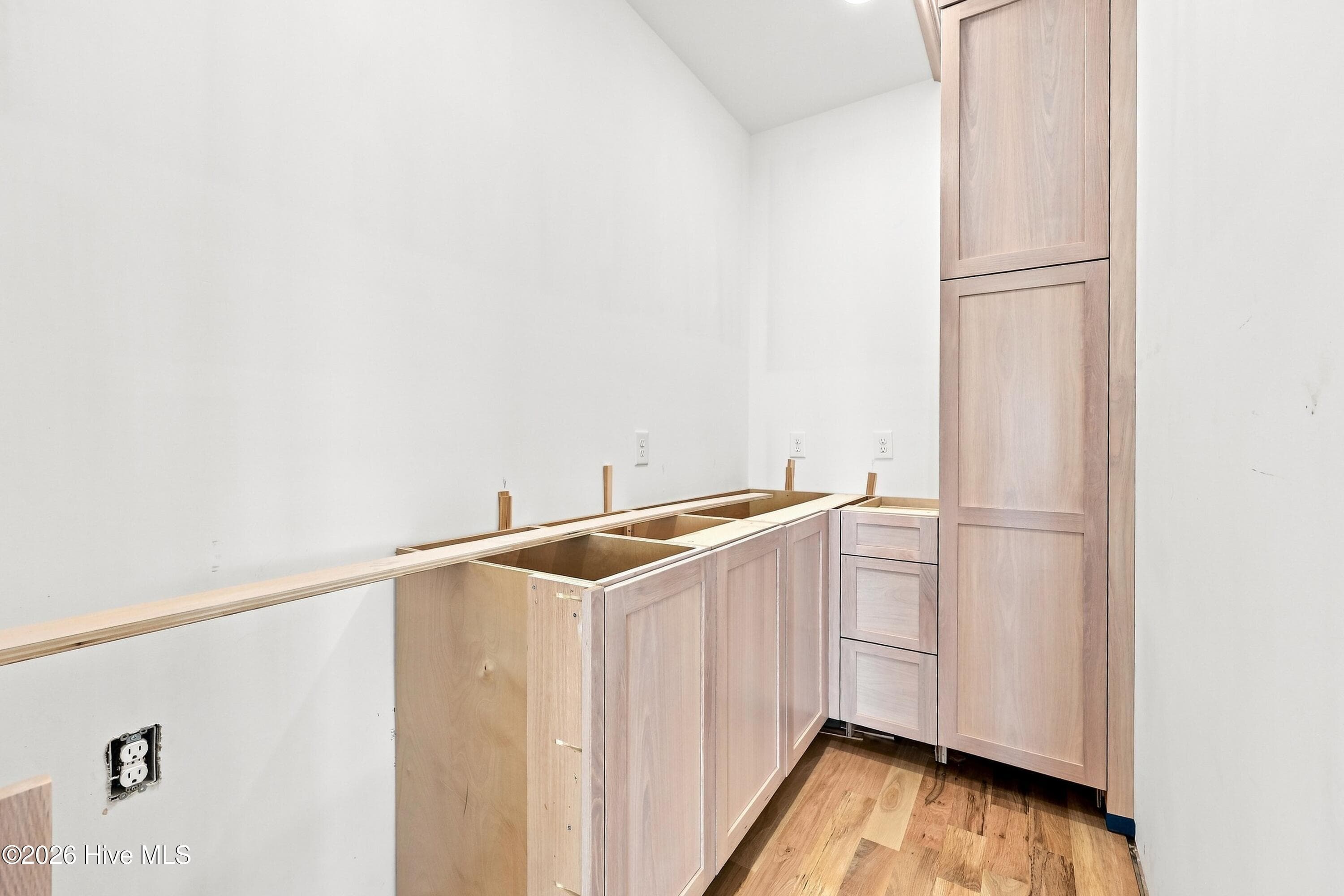 Walk in pantry with bar sink and beverage cooler - 2302 Emerald Drive, Emerald Isle, NC 28594