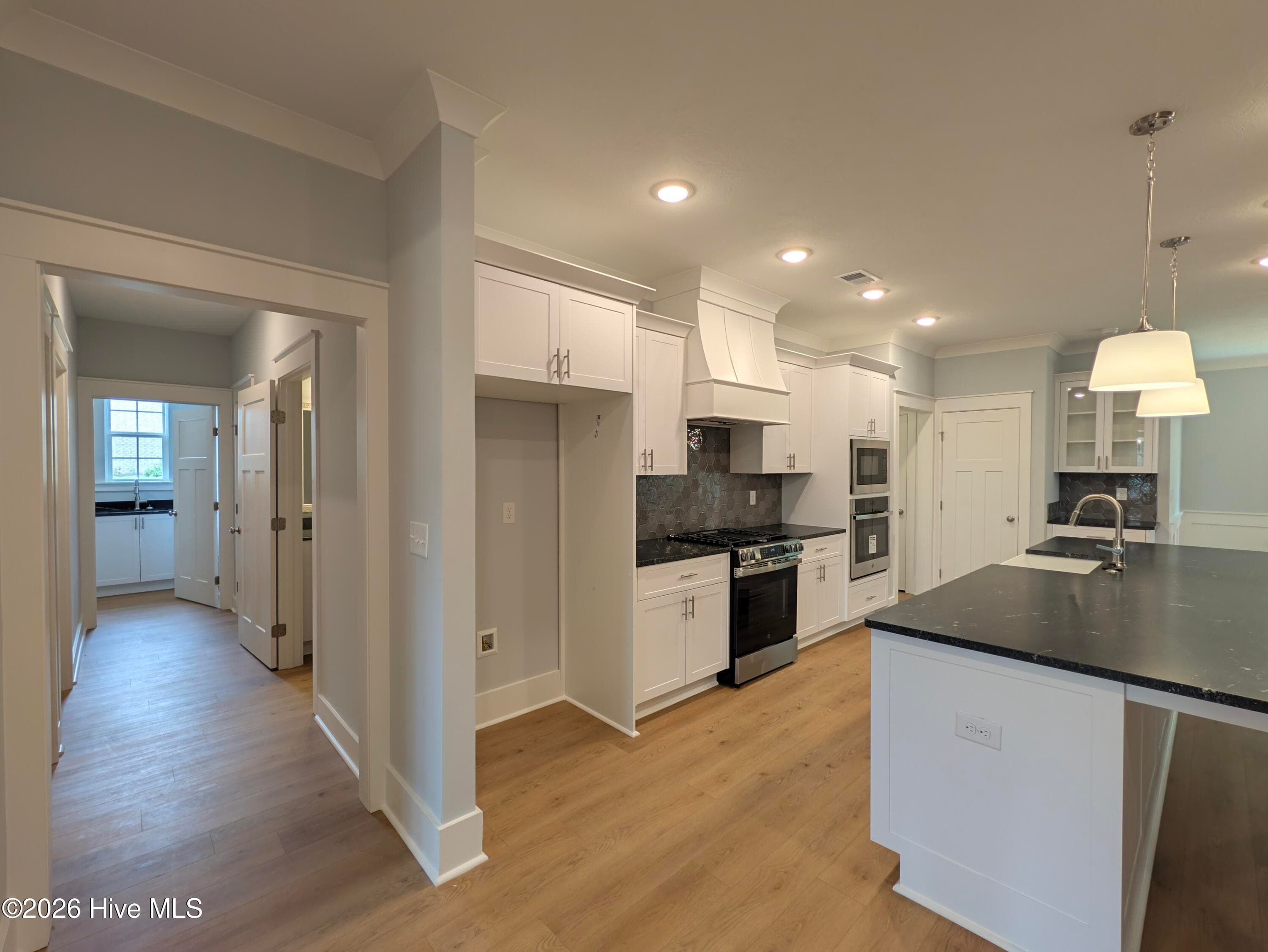 Custom vinyl-wrapped cabinets & vent hood - 434 Longshadow Drive, Aiken, SC 29803