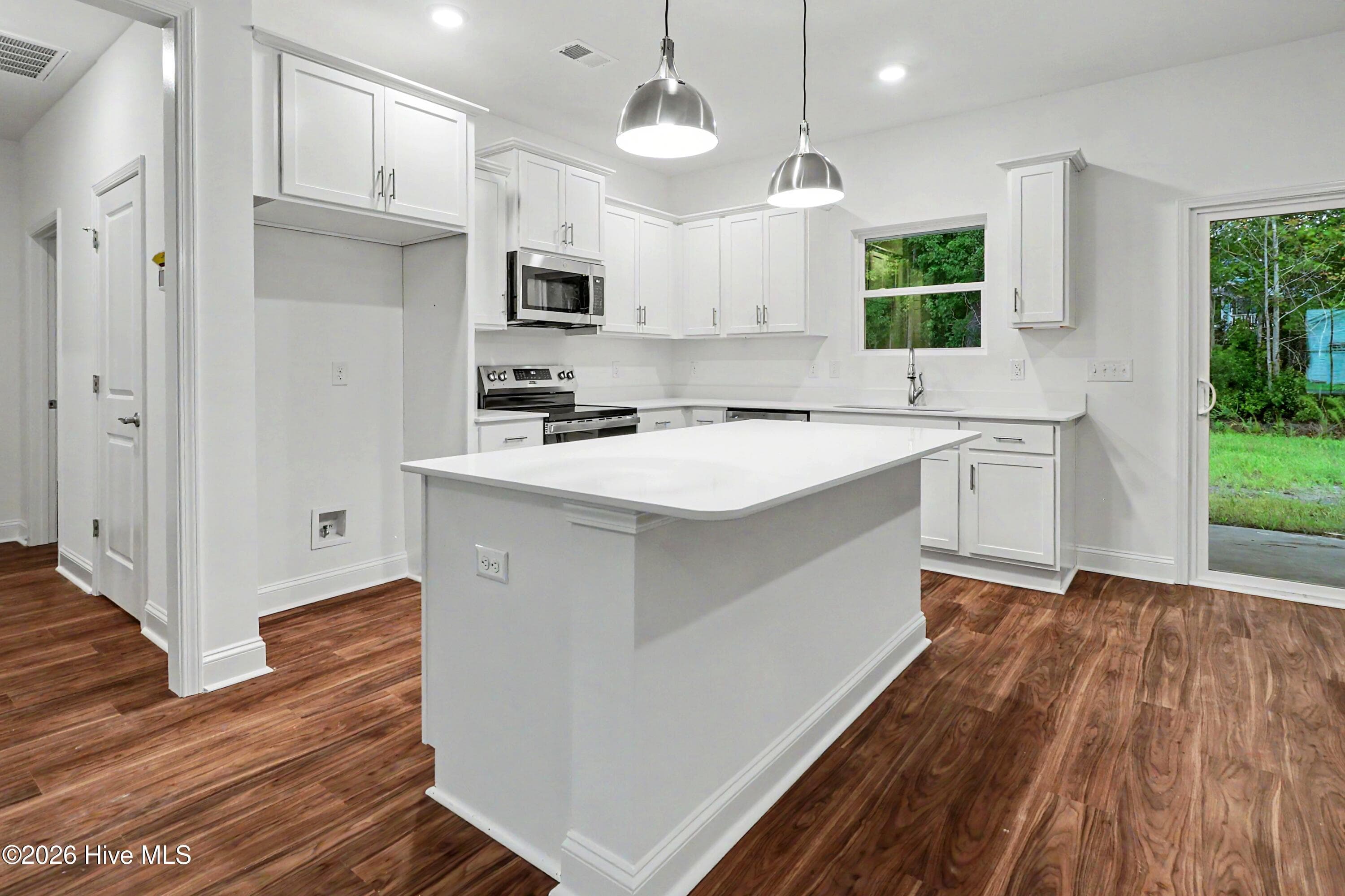 Lots of storage in Kitchen, with a walk-in pantry around the corner. - 2111 Cregan Cove SW (Lot 19), Ocean Isle Beach, NC 28469