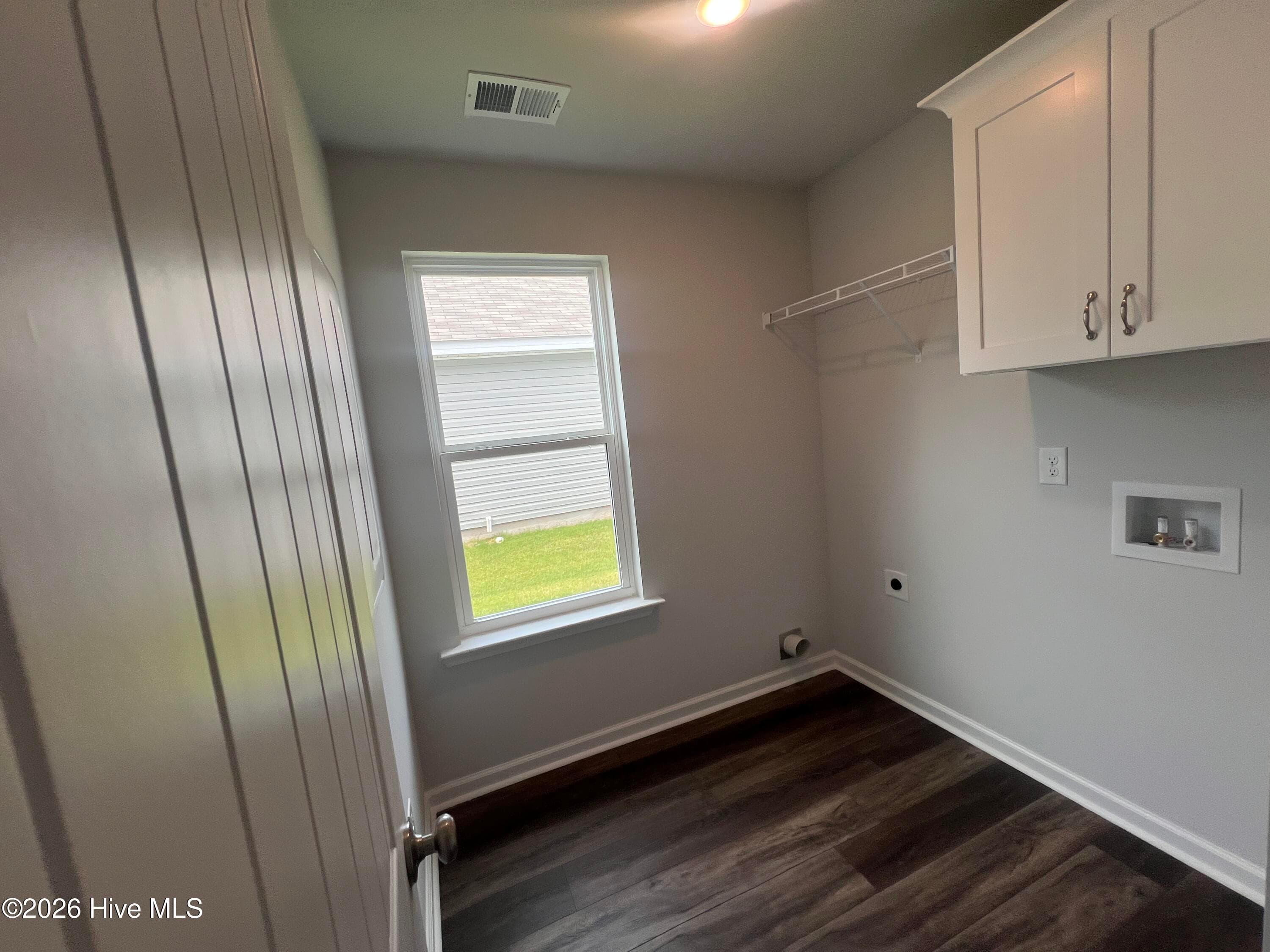 Laundry Room with cabinetry. - 8887 Snelling Drive, Aiken, SC 29803