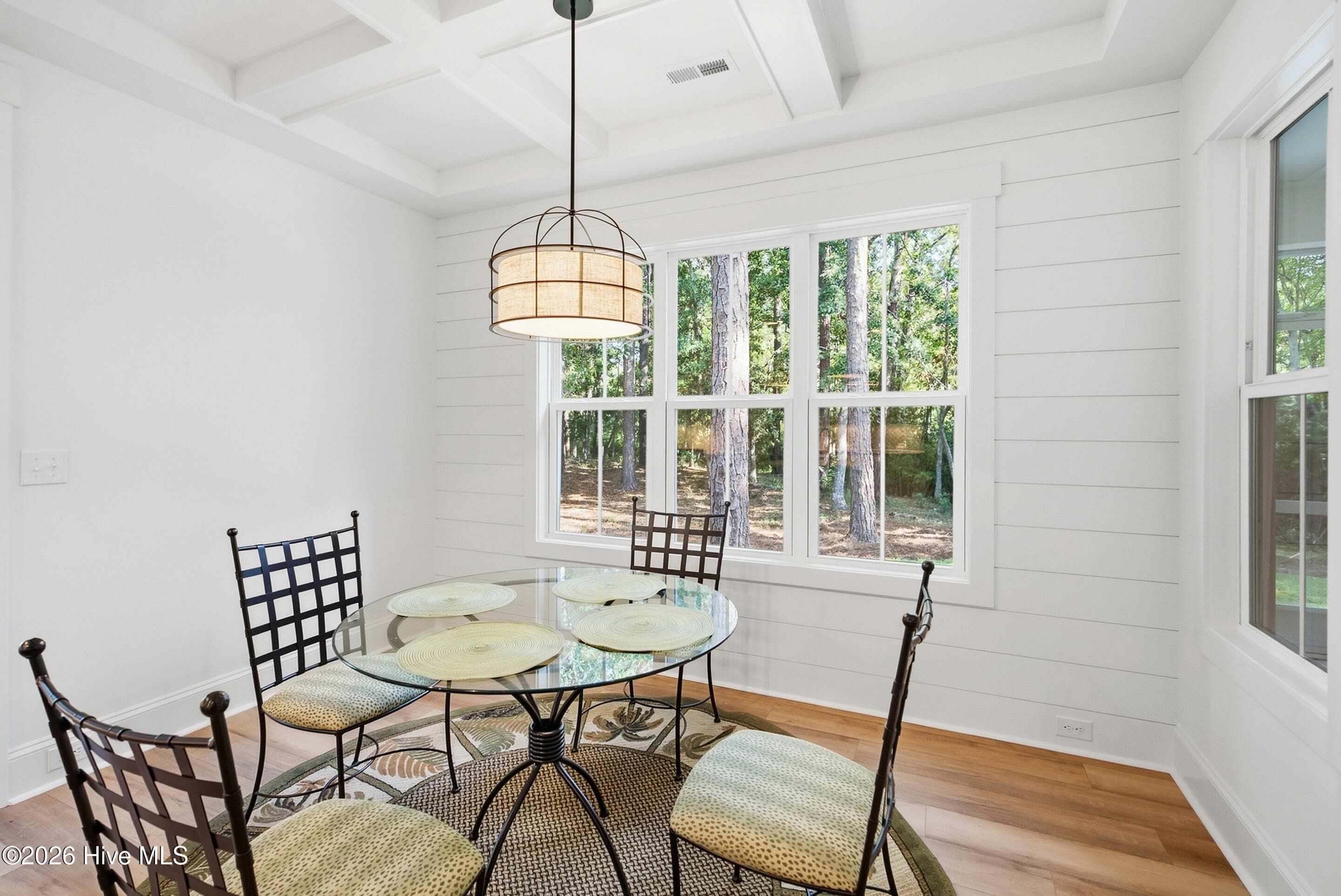 Dining area with coffer ceiling trim and shiplap wall - 3392 Eagle Crest Drive SW, Supply, NC 28462