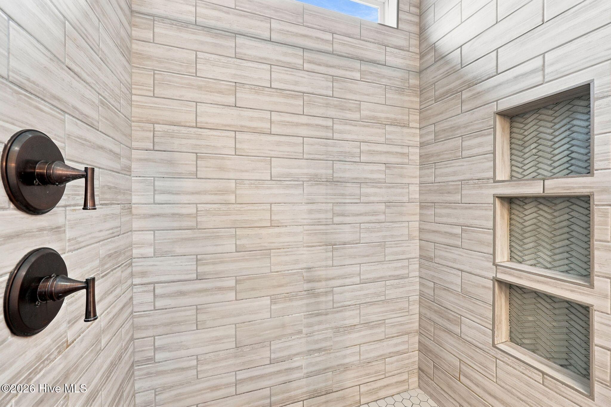 Tiled shower in primary suite - 2212 Marinwood Court, Greenville, NC 27834