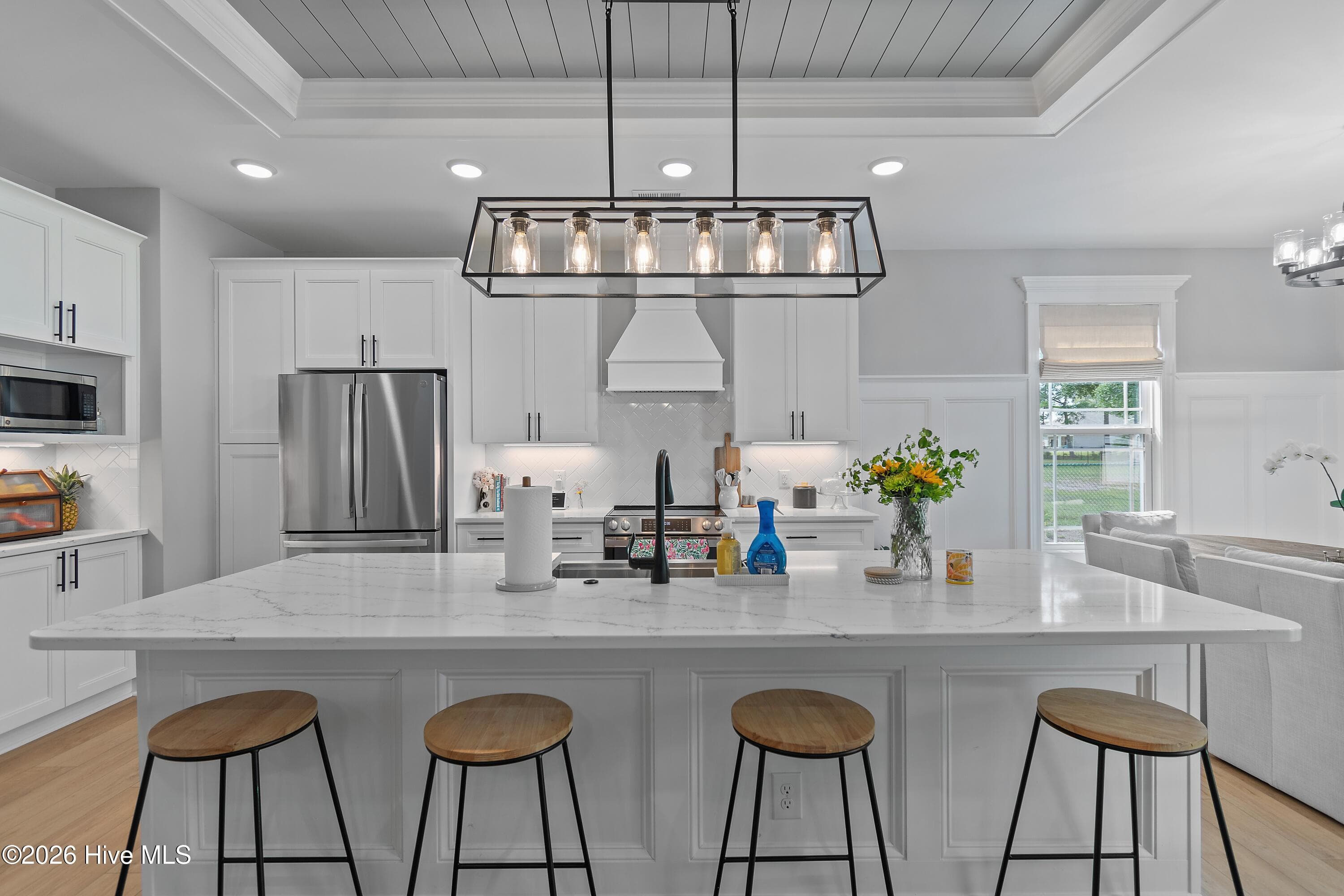 This center kitchen island adds both style and everyday function, making it one of the most desirable feature creating a natural gathering place while improving workflow and storage in the kitchen. - 299 Boundaryline Drive NW, Calabash, NC 28467