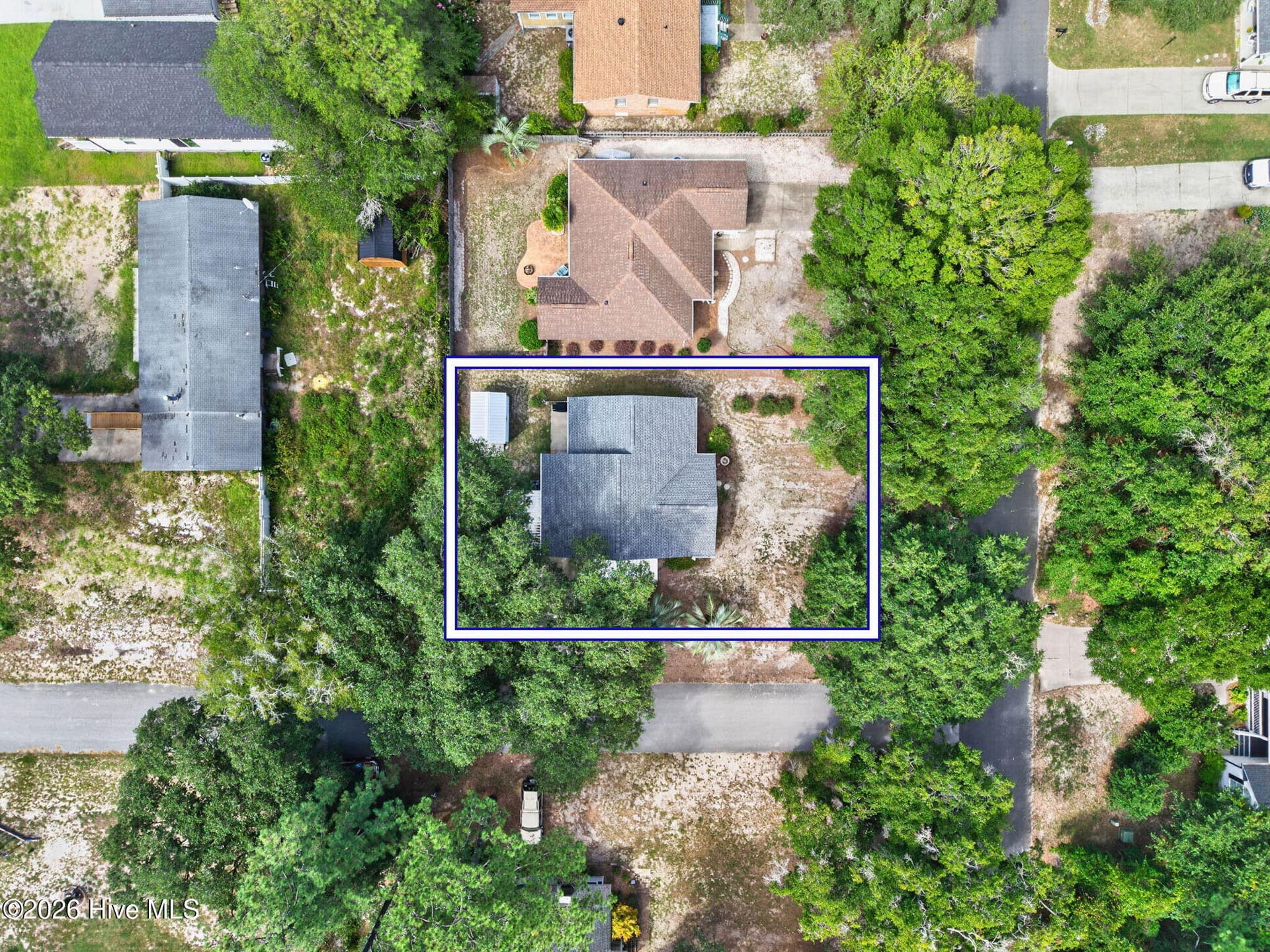 Overhead aerial view showcases the home's corner-lot setting and surrounding mainland Ocean Isle Beach neighborhood. - 1650 Frink Street SW, Ocean Isle Beach, NC 28469