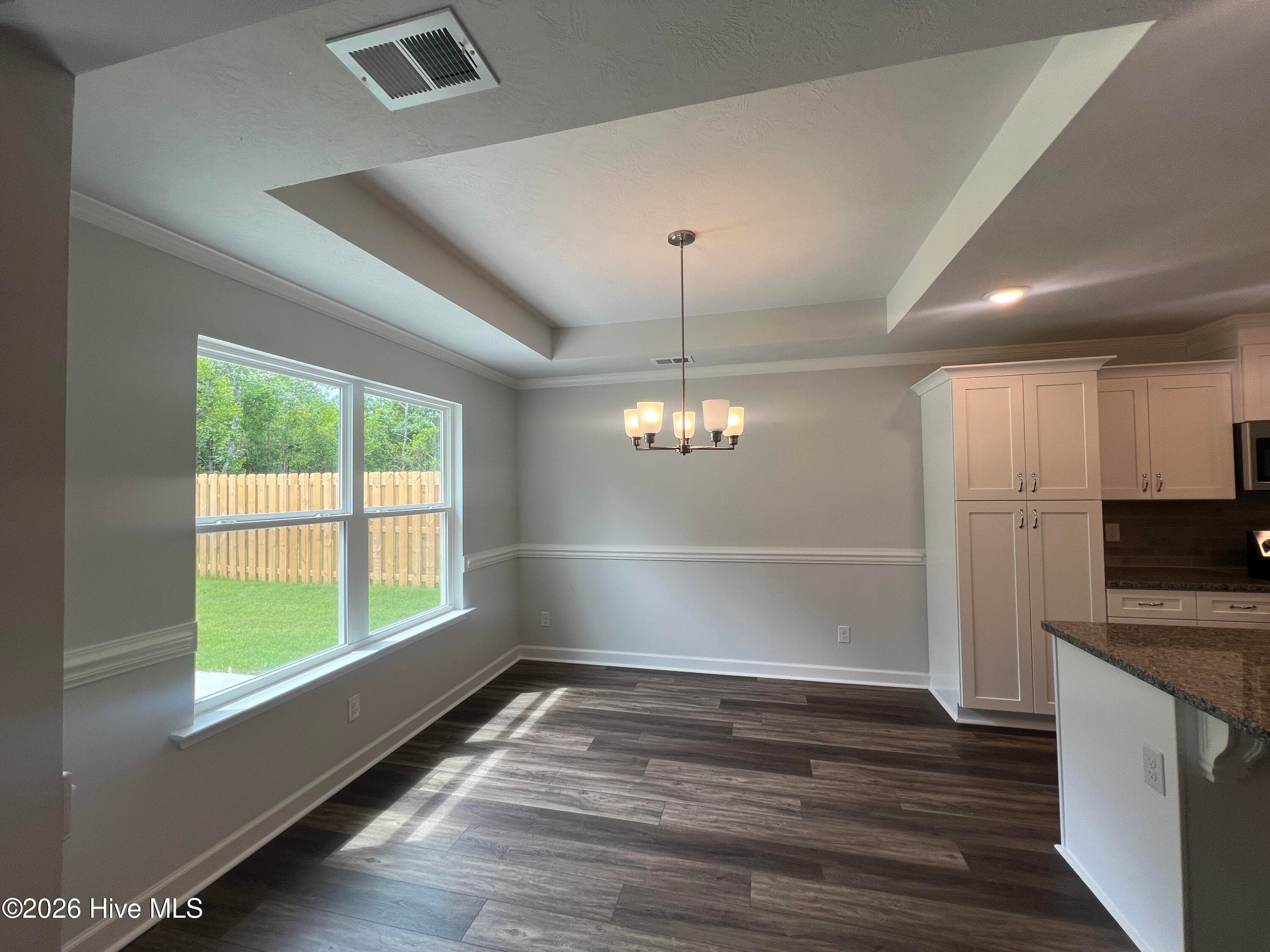 Spacious dining area with trey ceiling and tons of natural light. - 8887 Snelling Drive, Aiken, SC 29803