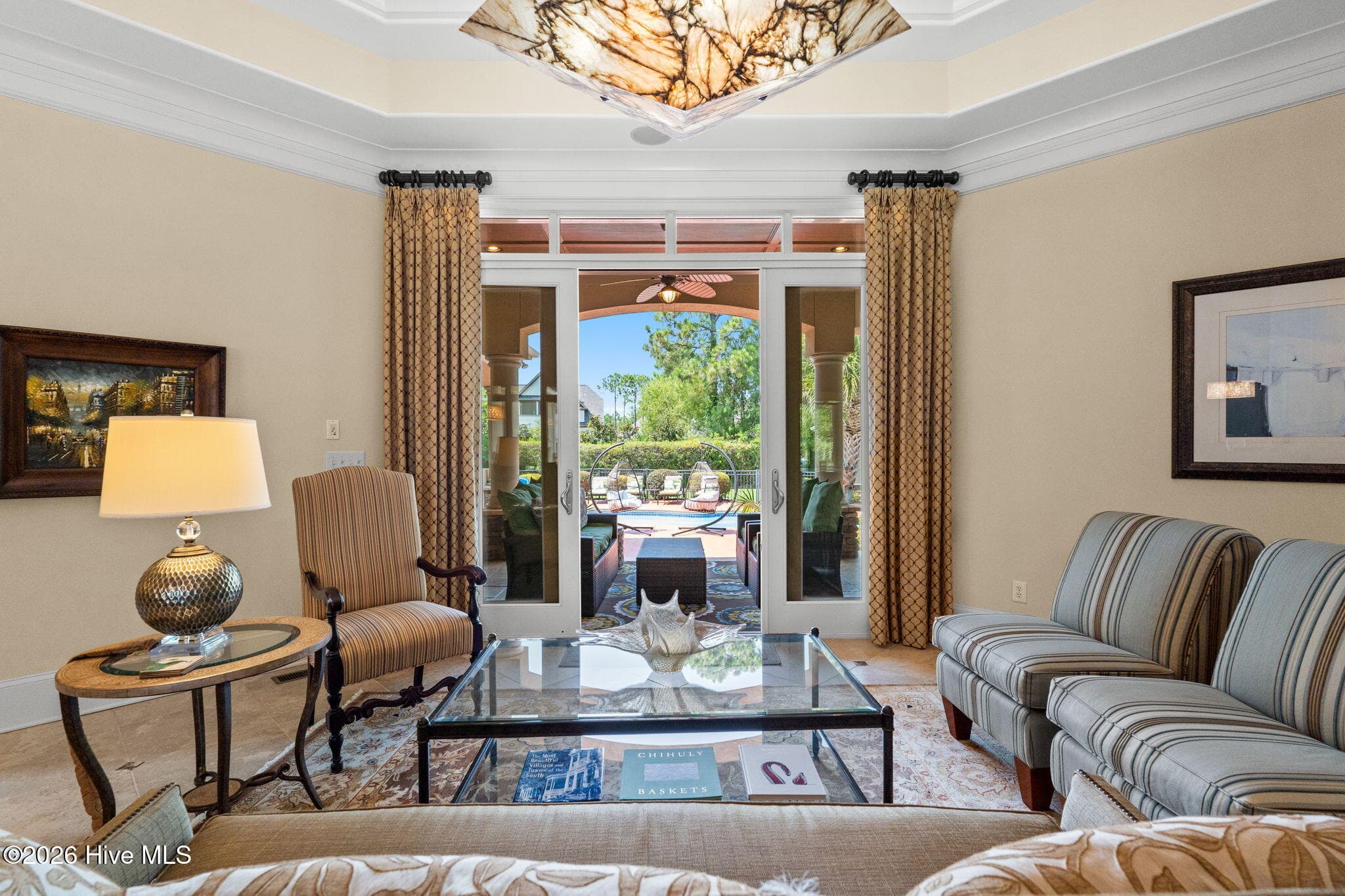 Beautiful tray ceiling and sliders lead to outdoor living - 3858 Ridge Crest Drive, Southport, NC 28461