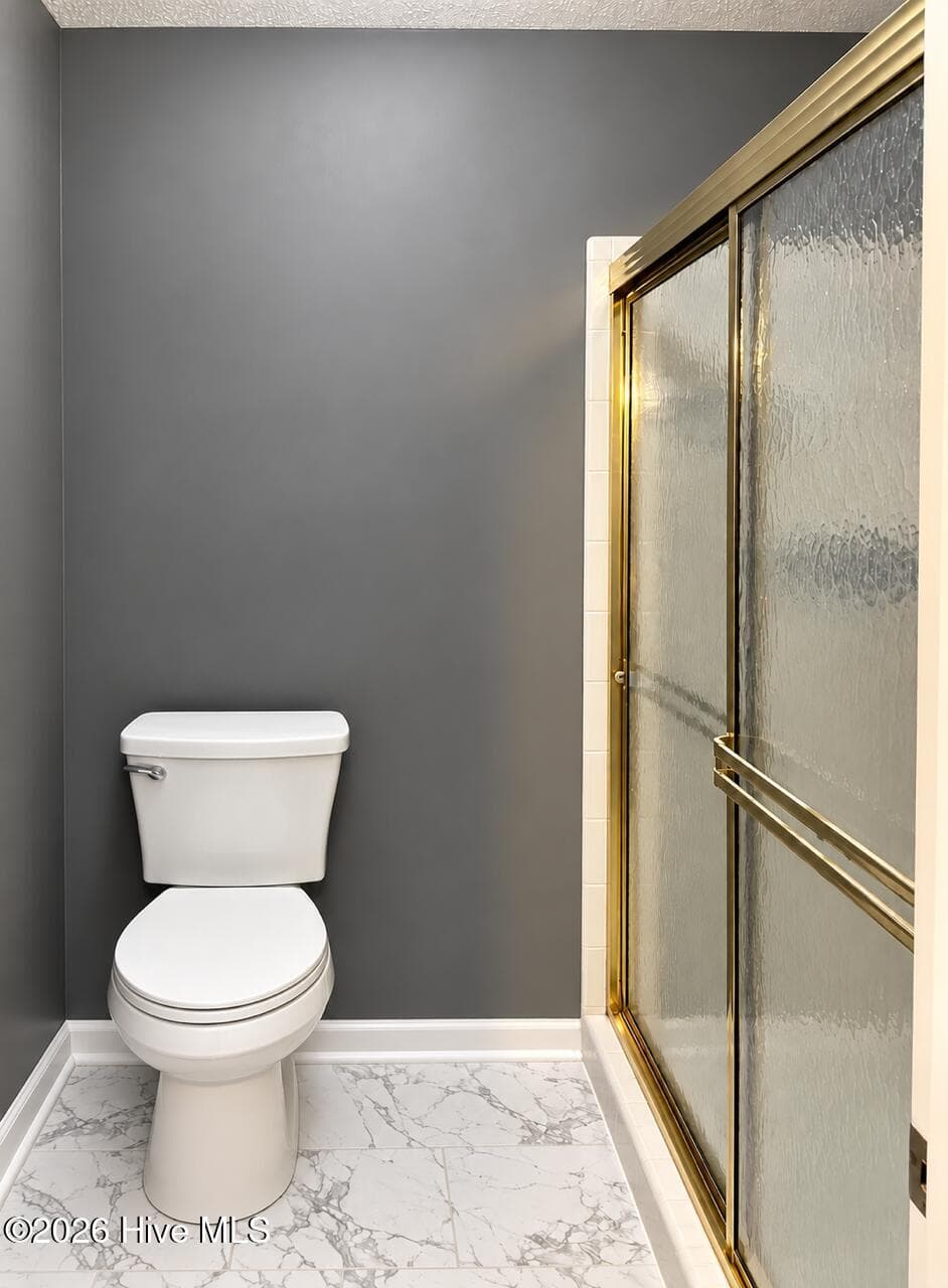 Owner bathroom with commode and shower with door for privacy. - 4164 Quail Springs Circle, Augusta, GA 30907