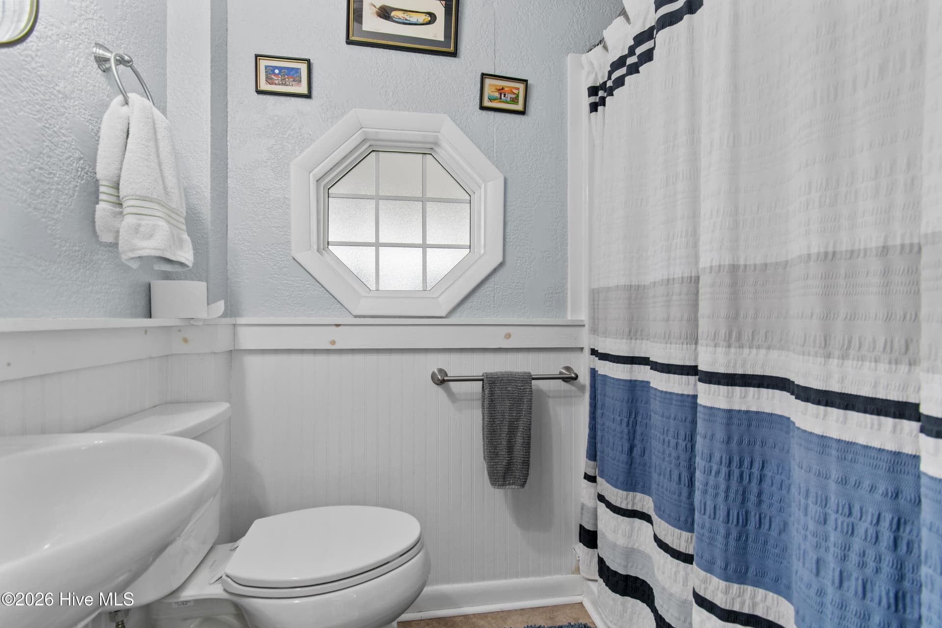 Ground floor bedroom #3 full bathroom. - 2024 Camelot Drive SW, Ocean Isle Beach, NC 28469