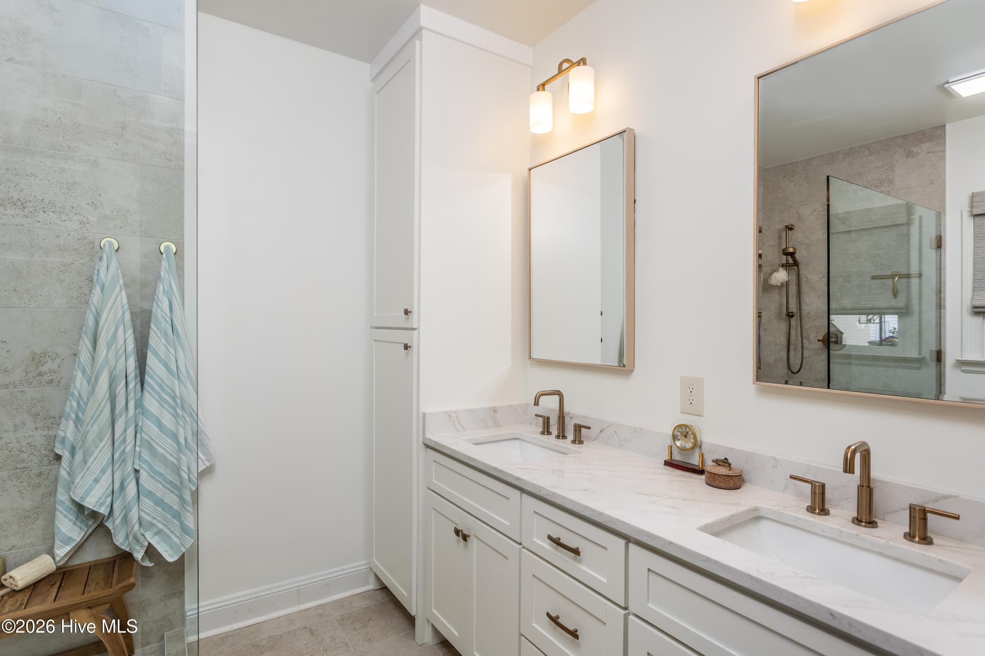 Double sink custom vanity and storage tower in primary - 5050 Country Club Drive N, Wilson, NC 27896