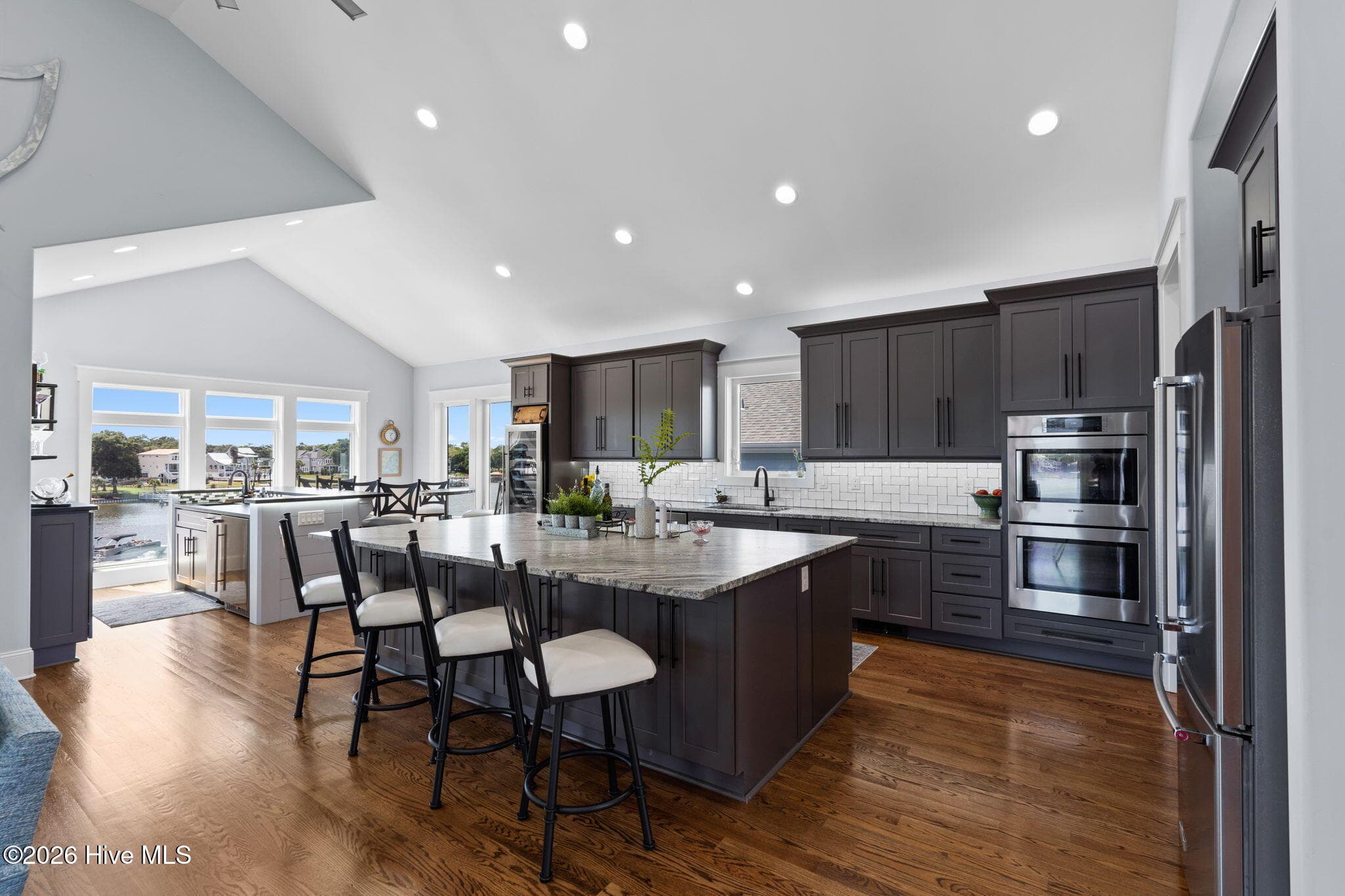 Center island is a full slab of granite with under counter storage on both sides - 2775 Long Bay Drive SE, Southport, NC 28461