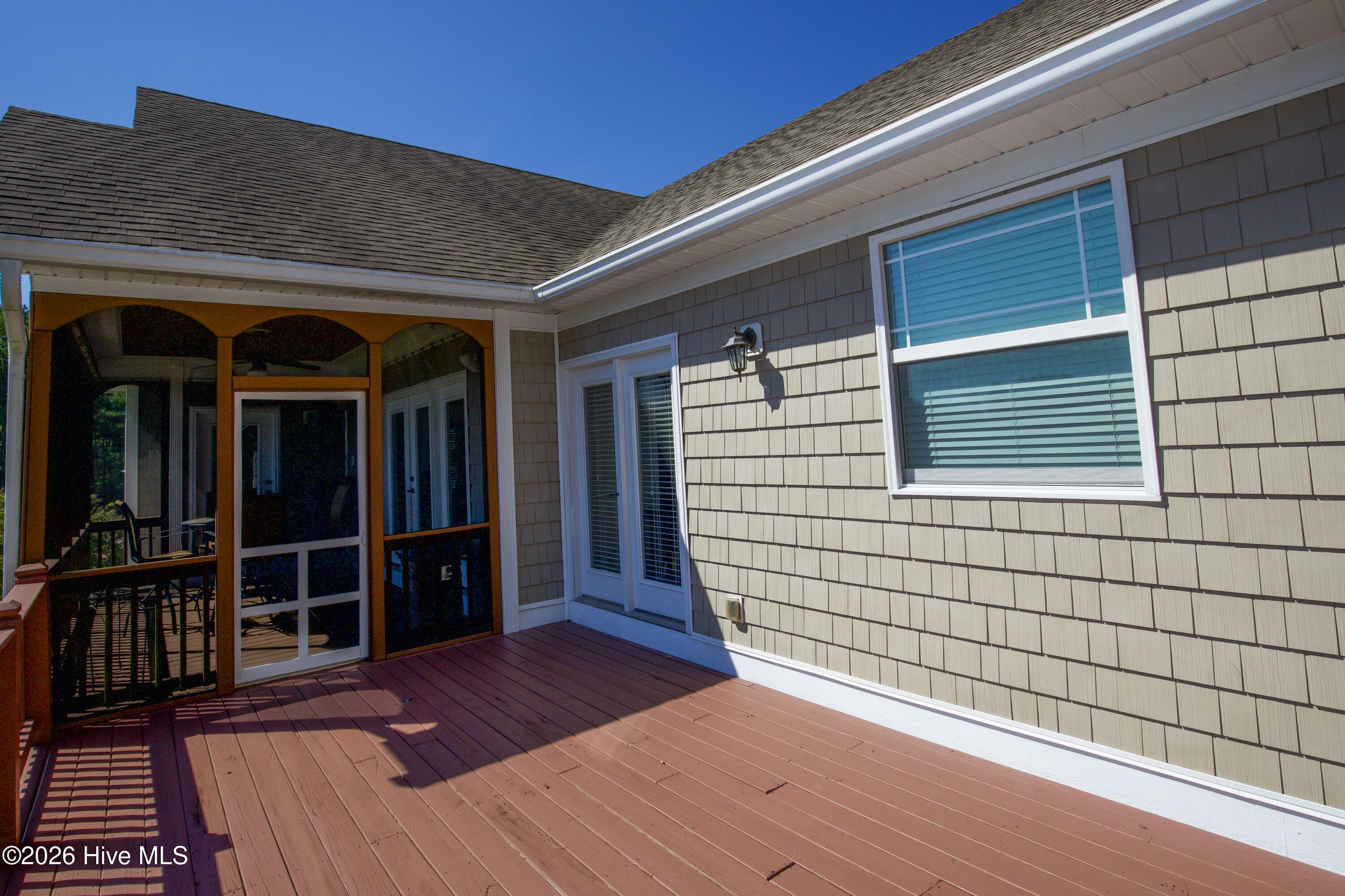 Open deck at 899 Seagull Drive with French doors and wall lights, Woodlake, Vass NC. - 899 Seagull Drive, Vass, NC 28394, Vass