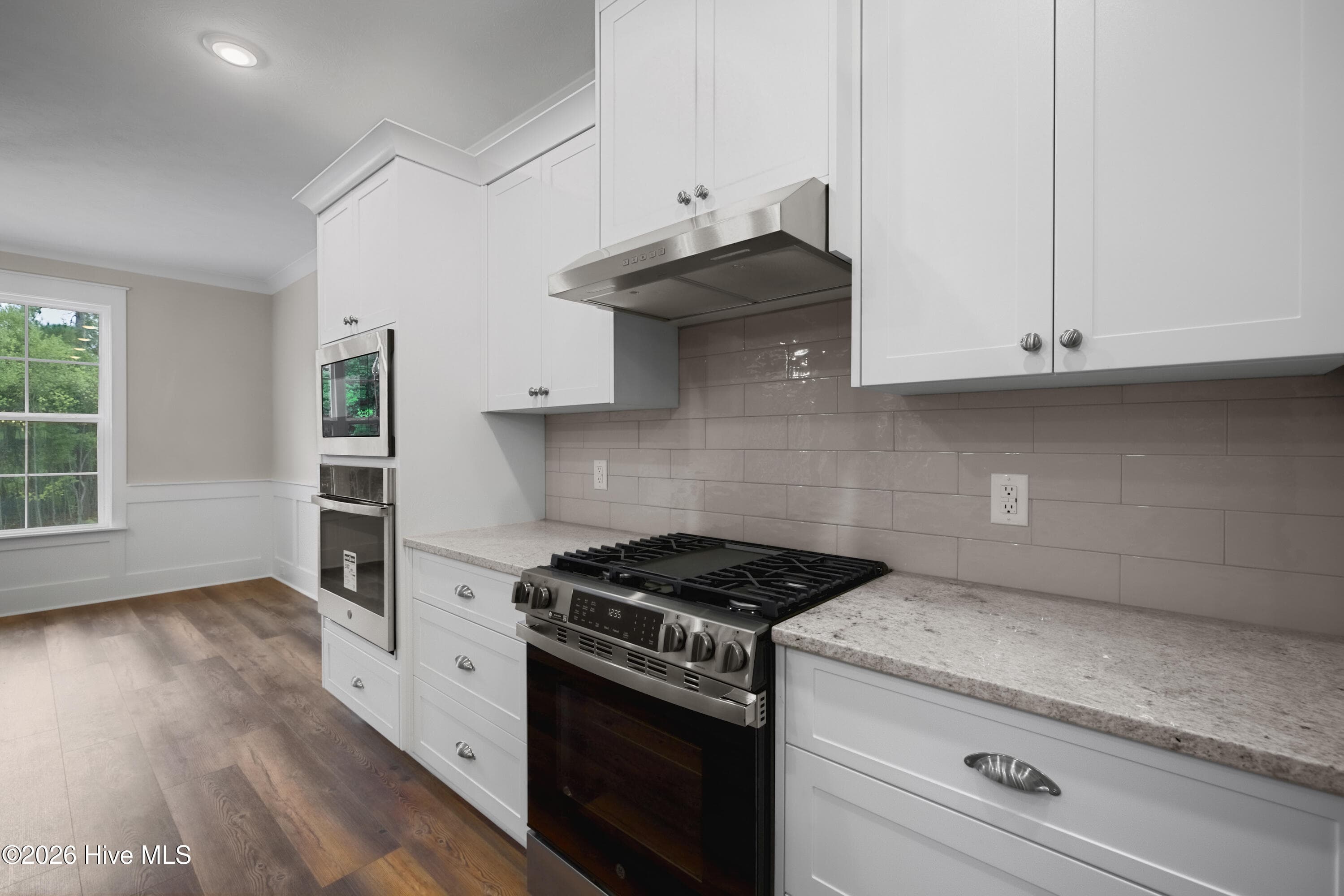 Gas range and tile backsplash - 1200 Bellingham Drive, Beech Island, SC 29842