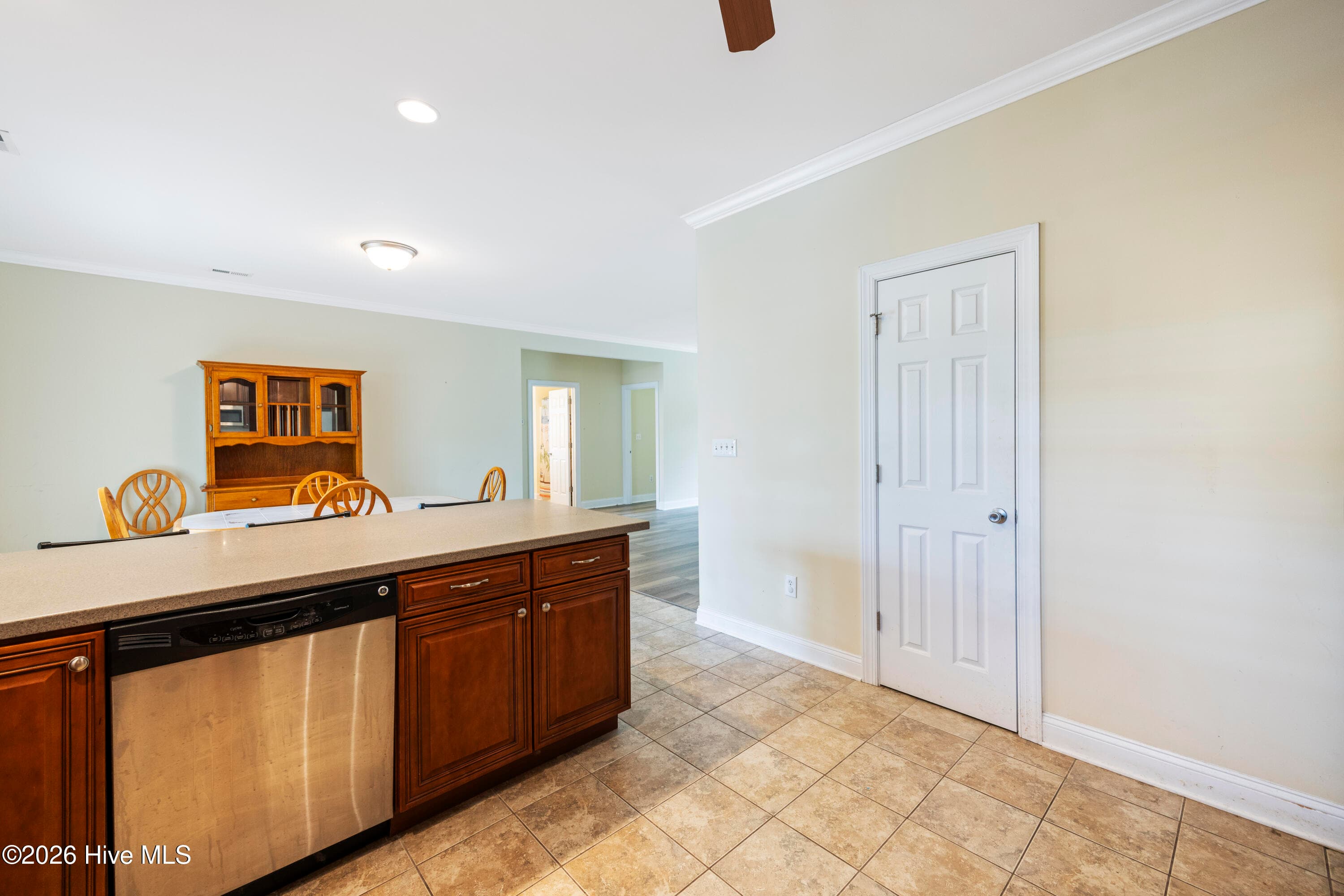 KITCHEN with Pantry Door at the right - 225 NE 39th Street, Oak Island, NC 28465