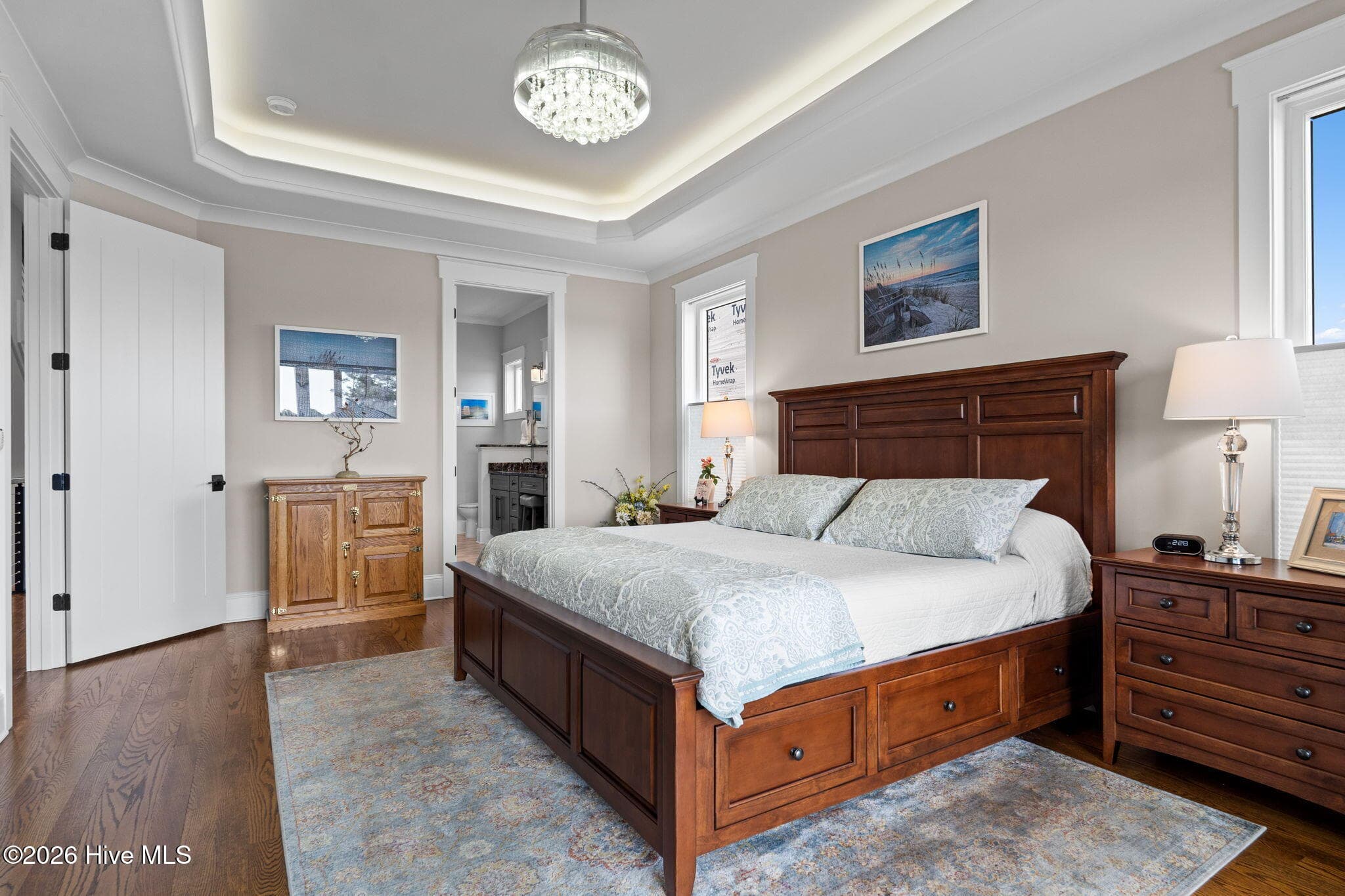 Lighted tray ceiling with a beautiful glass light/fan combo that brings sparkle to the room - 2775 Long Bay Drive SE, Southport, NC 28461