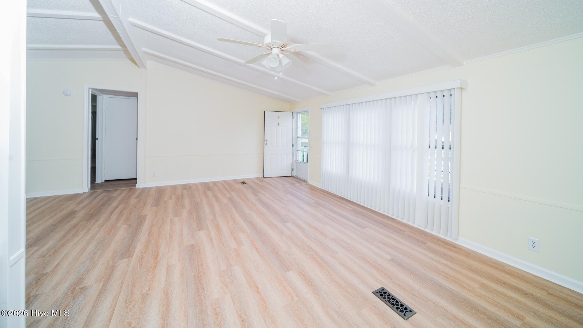 A ceiling fanand triple windows make this a welcoming room - 1076 Clubview Lane SW, Calabash, NC 28467
