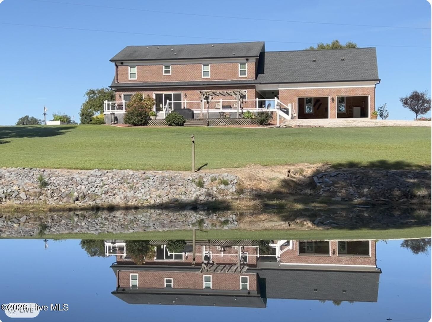 Rear of house looking over Pond back towards the rear of house. - 642 Enoch Road, Clinton, NC 28328