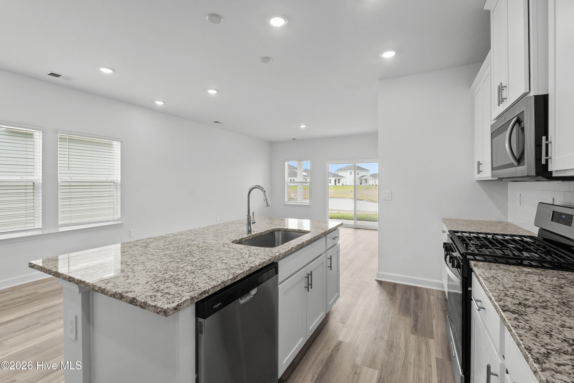 Photo is not of the actual home, but is an example photo of a completed home and may depict options and/or features that are not included - 2217 Lewis Allen Crossing NW, Ash, NC 28420