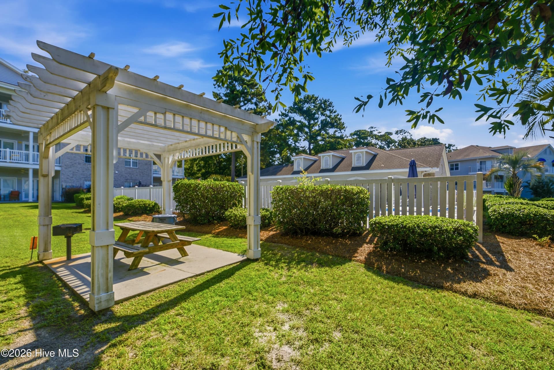 Gazebo with Picnic area adjacent to the Pool - 908 Resort Circle Unit 203, Sunset Beach, NC 28468