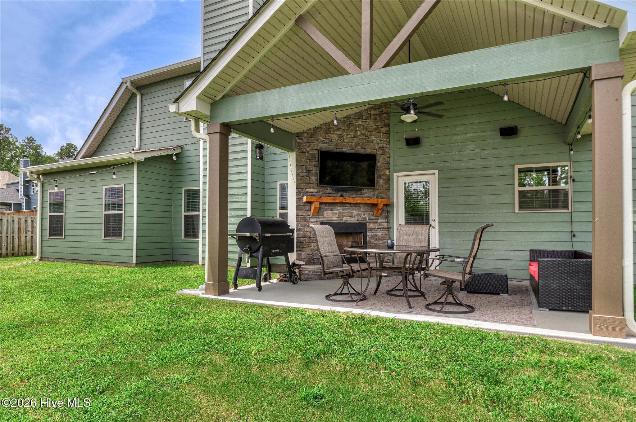 Backyard covered patio w/ wood burning fireplace - 257 Haverford Drive, Grovetown, GA 30813