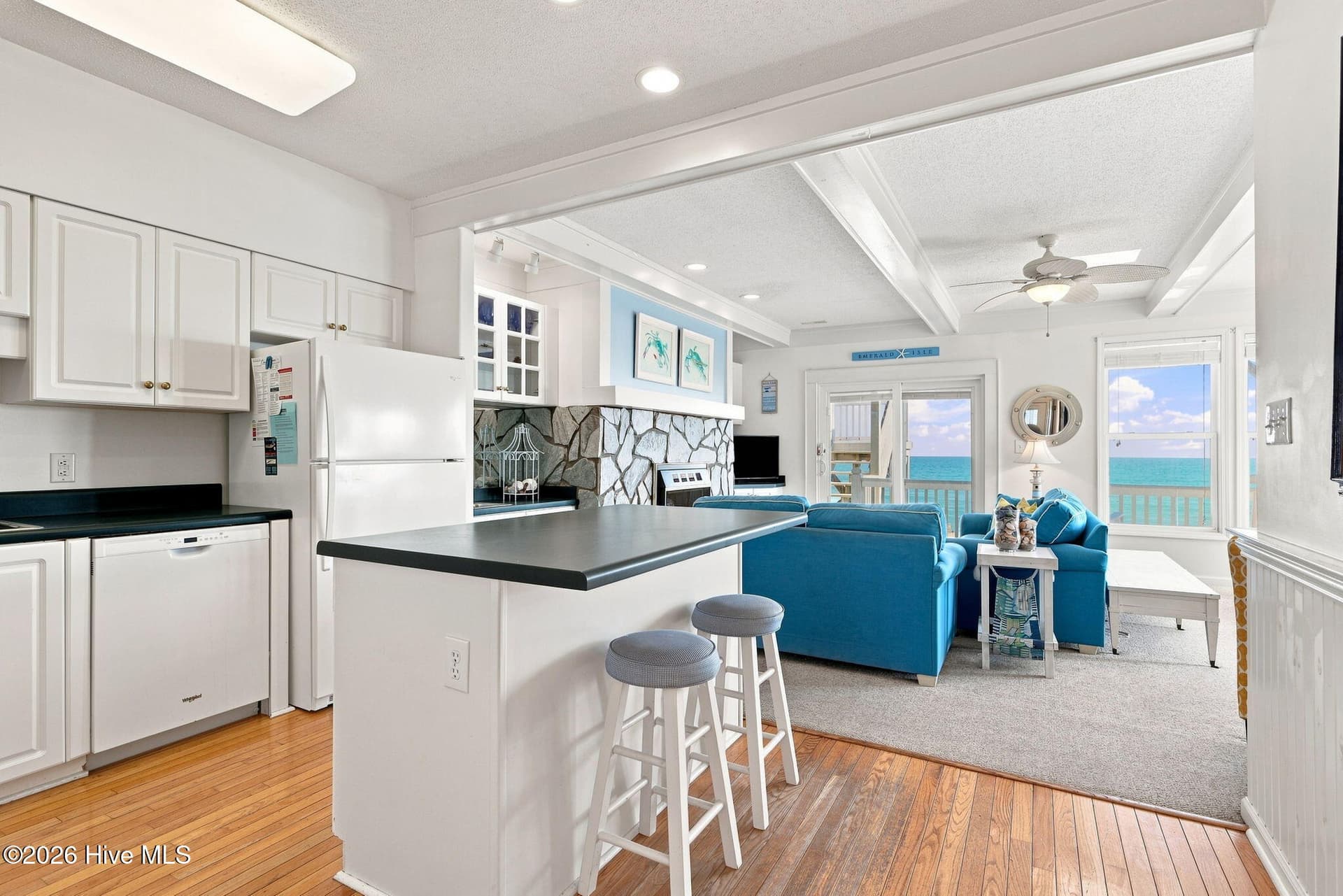 Hardwood floors greet you at the entrance and continue through the hallway and kitchen area. - 2801 Pier Pointe Drive B2, Emerald Isle, NC 28594