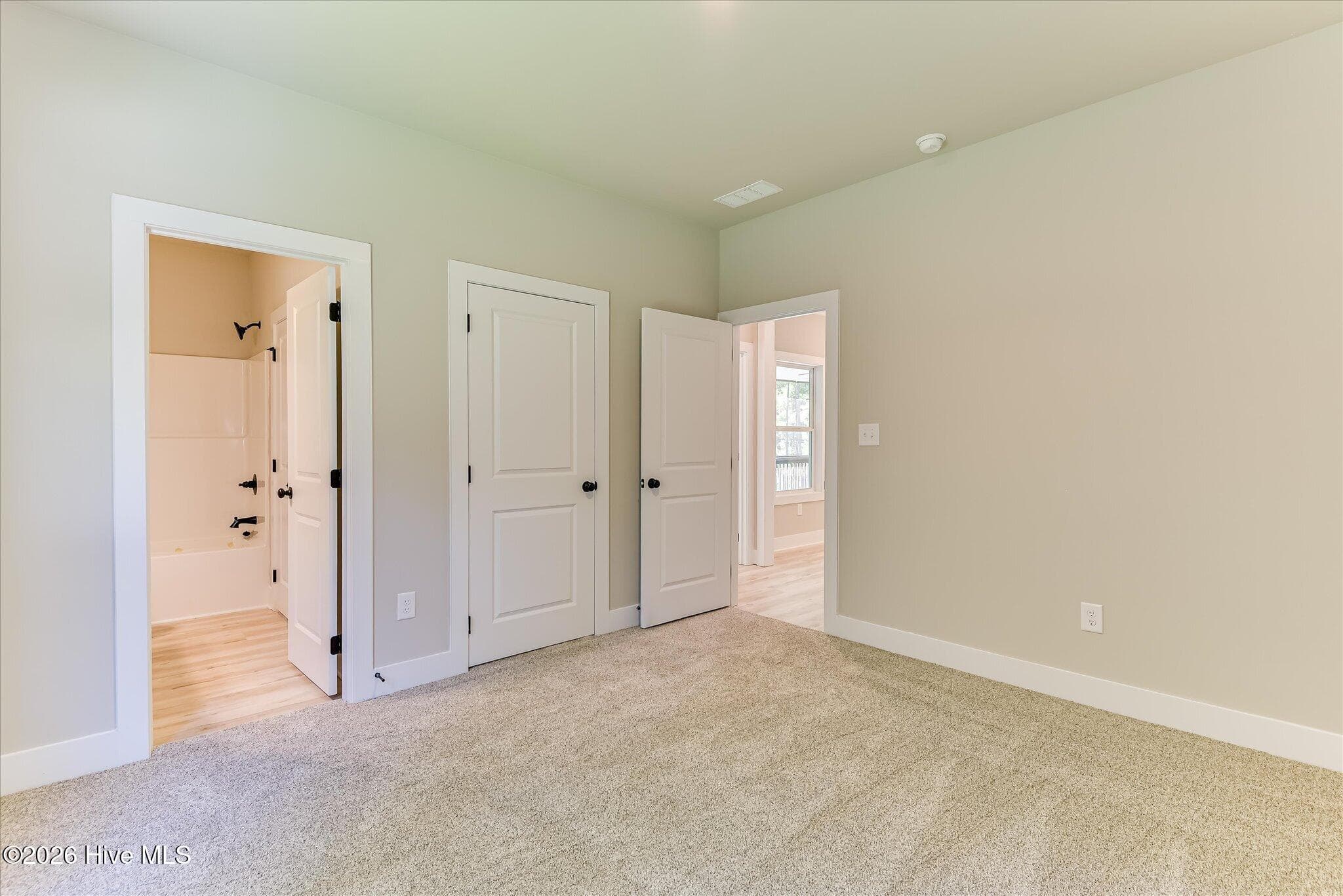 Bedroom 2 with shared access to full bathroom - 1198 Sunset Cove, Tignall, GA 30668