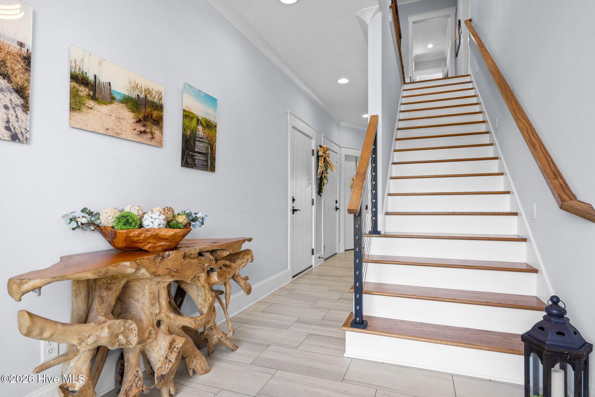 From the entry, the steps take you directly to the next 2 floors or you can take the elevator - 2775 Long Bay Drive SE, Southport, NC 28461