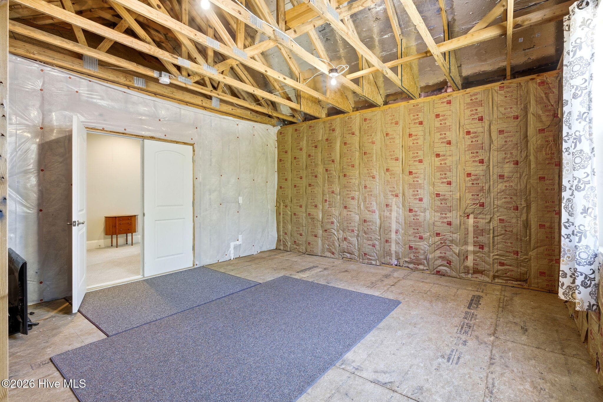 Unfinished Storage room that could be finished as additional living area! - 3784 Crab Catcher Loop NE, Leland, NC 28451