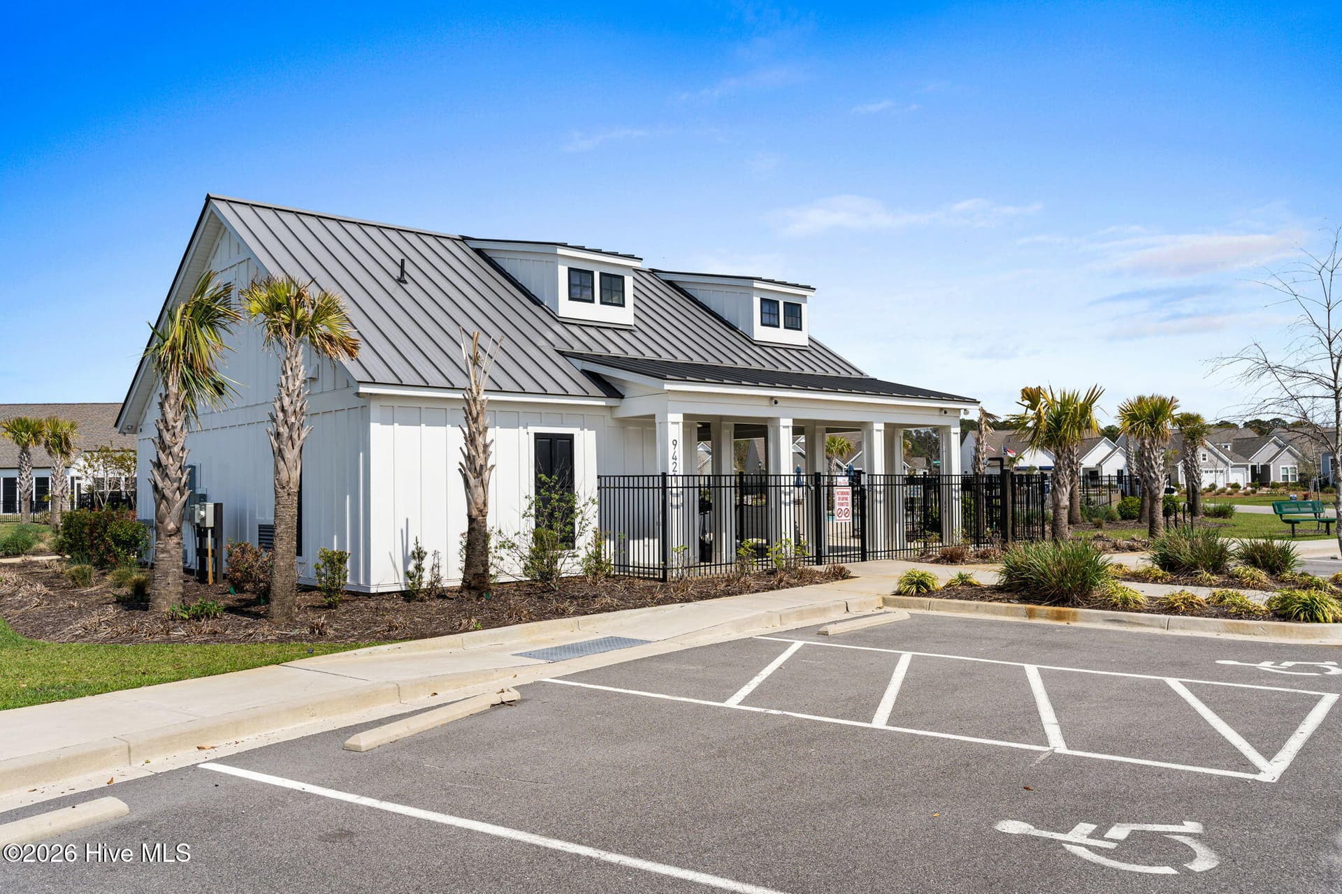 The Eagle Run clubhouse provides residents with a welcoming space conveniently located within the community. - 139 Eagle Claw Drive, Calabash, NC 28467