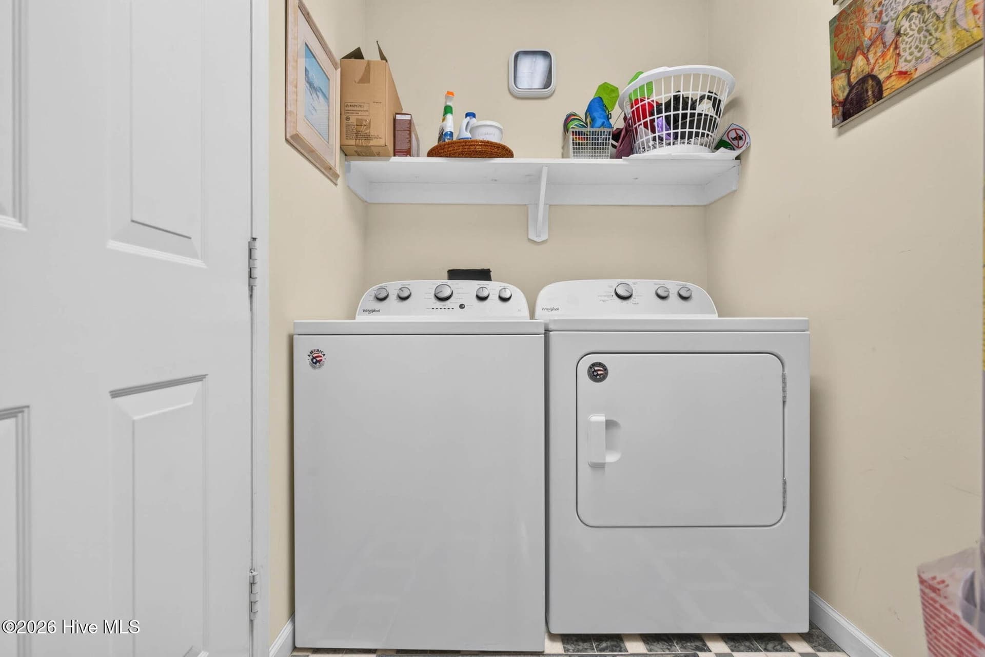 Dedicated laundry area with washer and dryer provides added convenience for full-time living or vacation stays. - 1650 Frink Street SW, Ocean Isle Beach, NC 28469