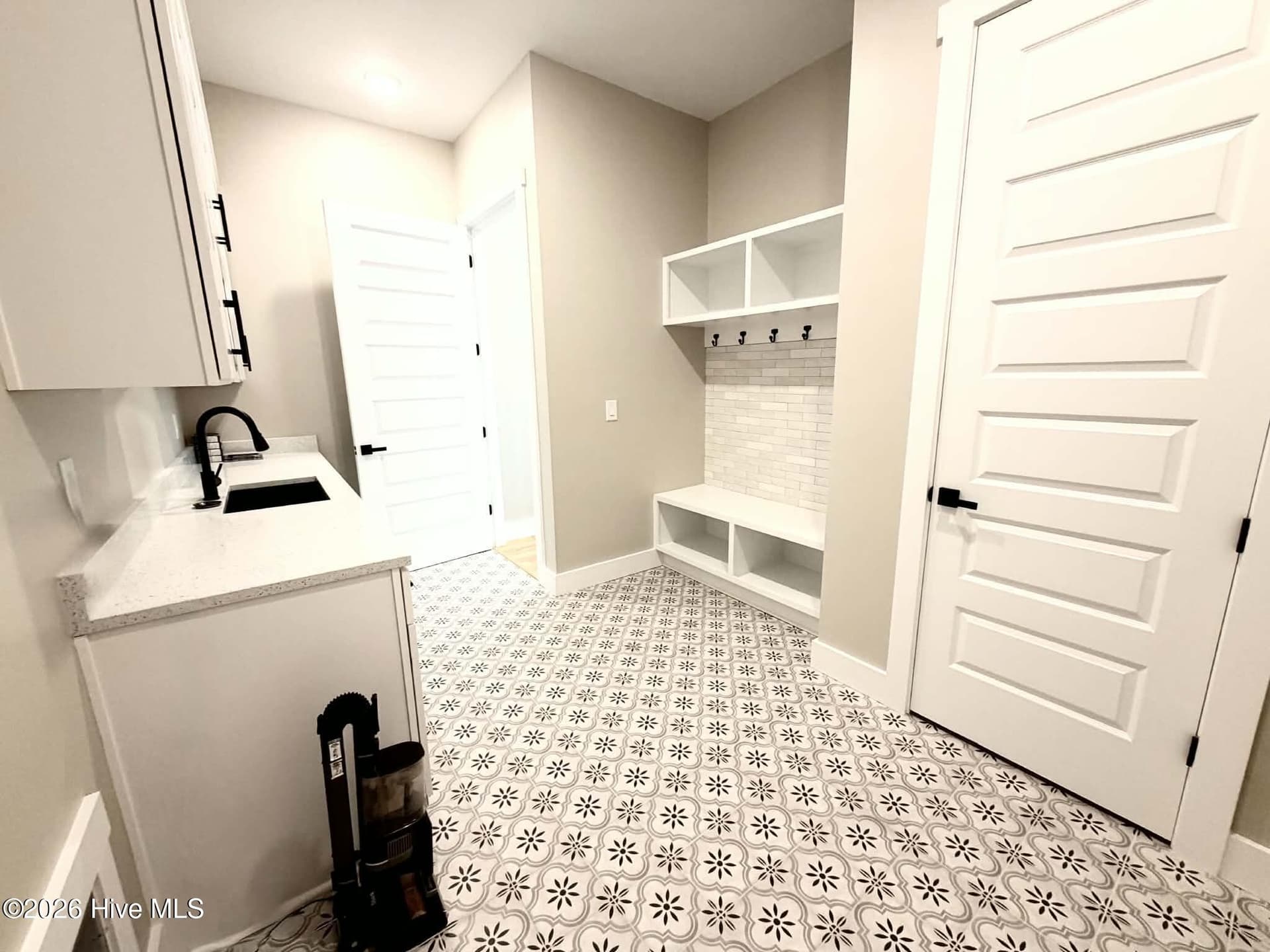 Laundry/mud room with entry from garage. - 550 Glenburnie Street NW, Calabash, NC 28467