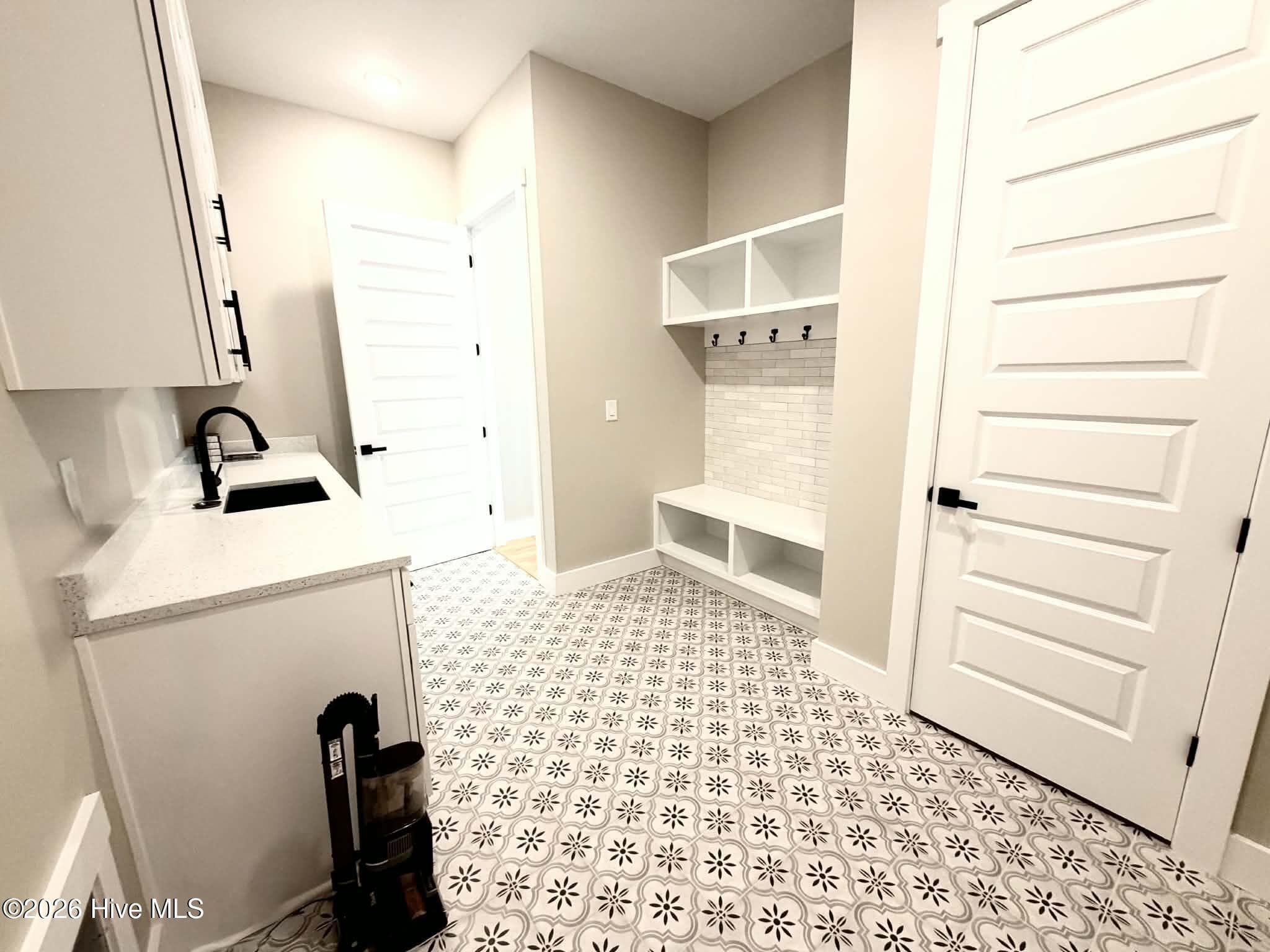 Laundry/mud room with entry from garage. - 550 Glenburnie Street NW, Calabash, NC 28467
