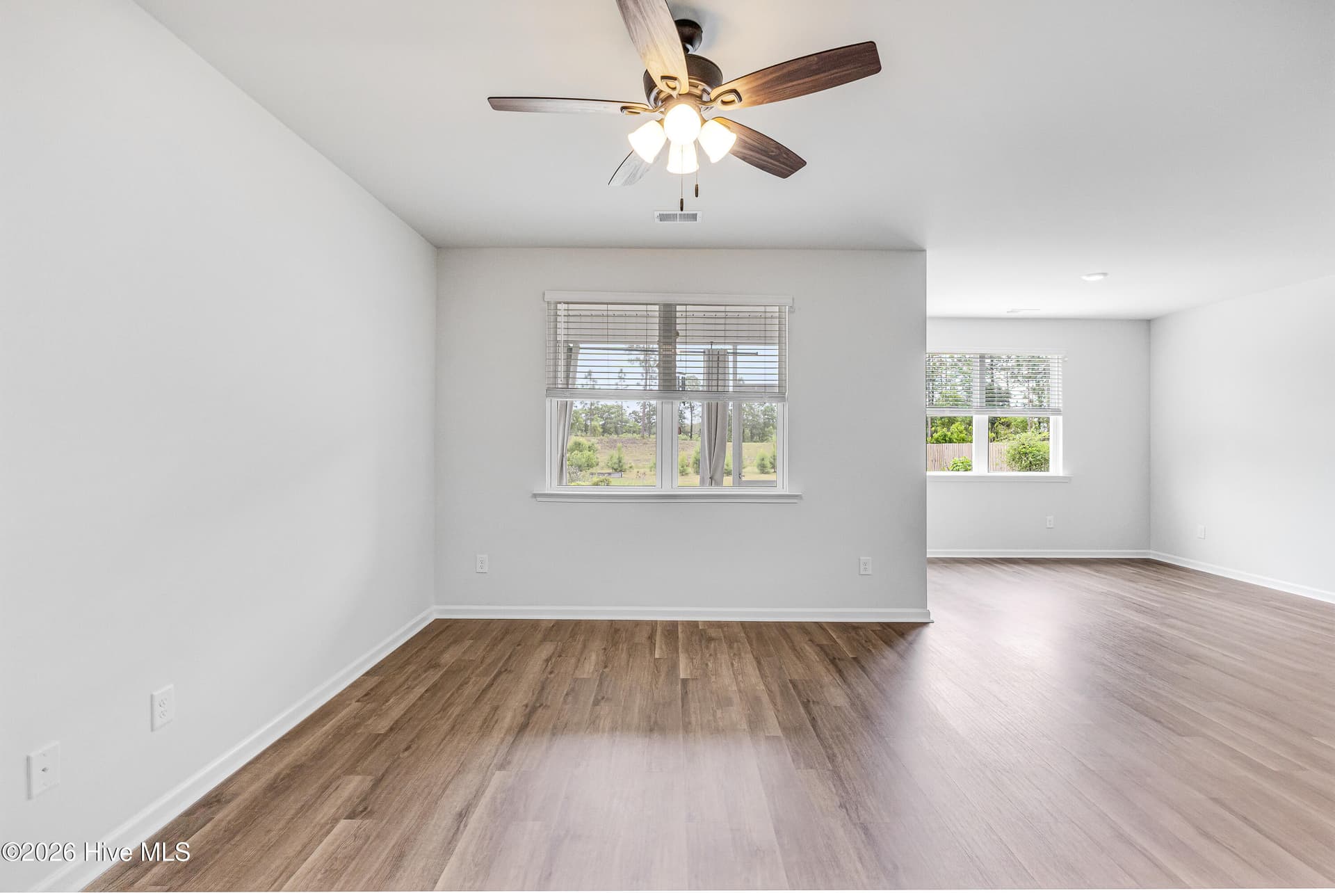 Open concept living and dining area - 1038 Burled Oak Ridge Loop SE, Bolivia, NC 28422